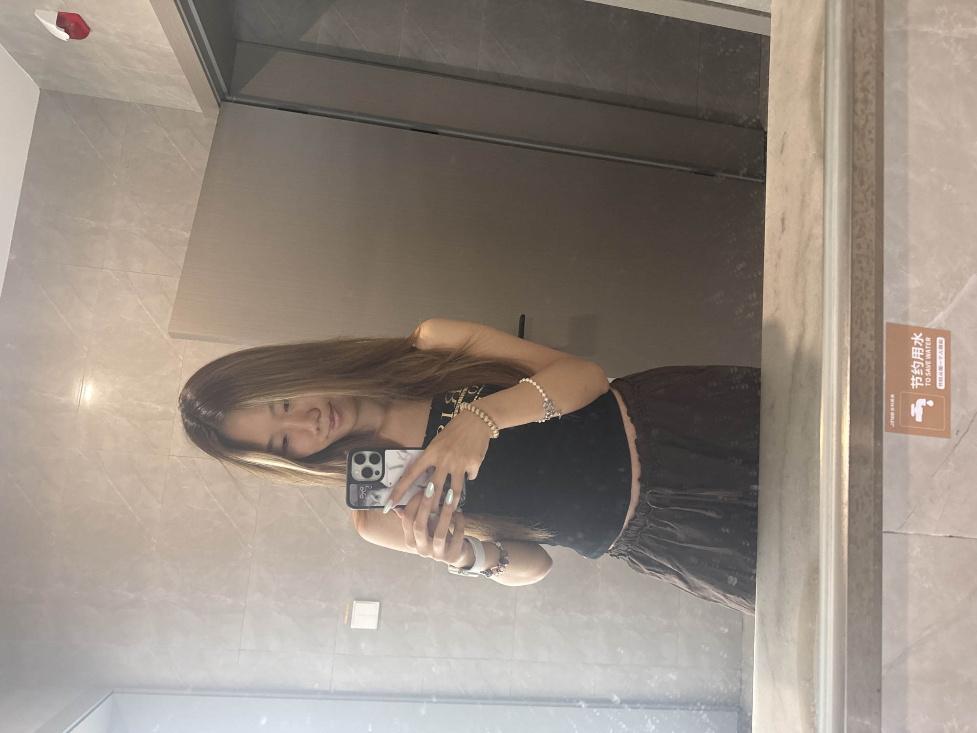 Woman takes extended mirror selfie session in Chongqing bathroom