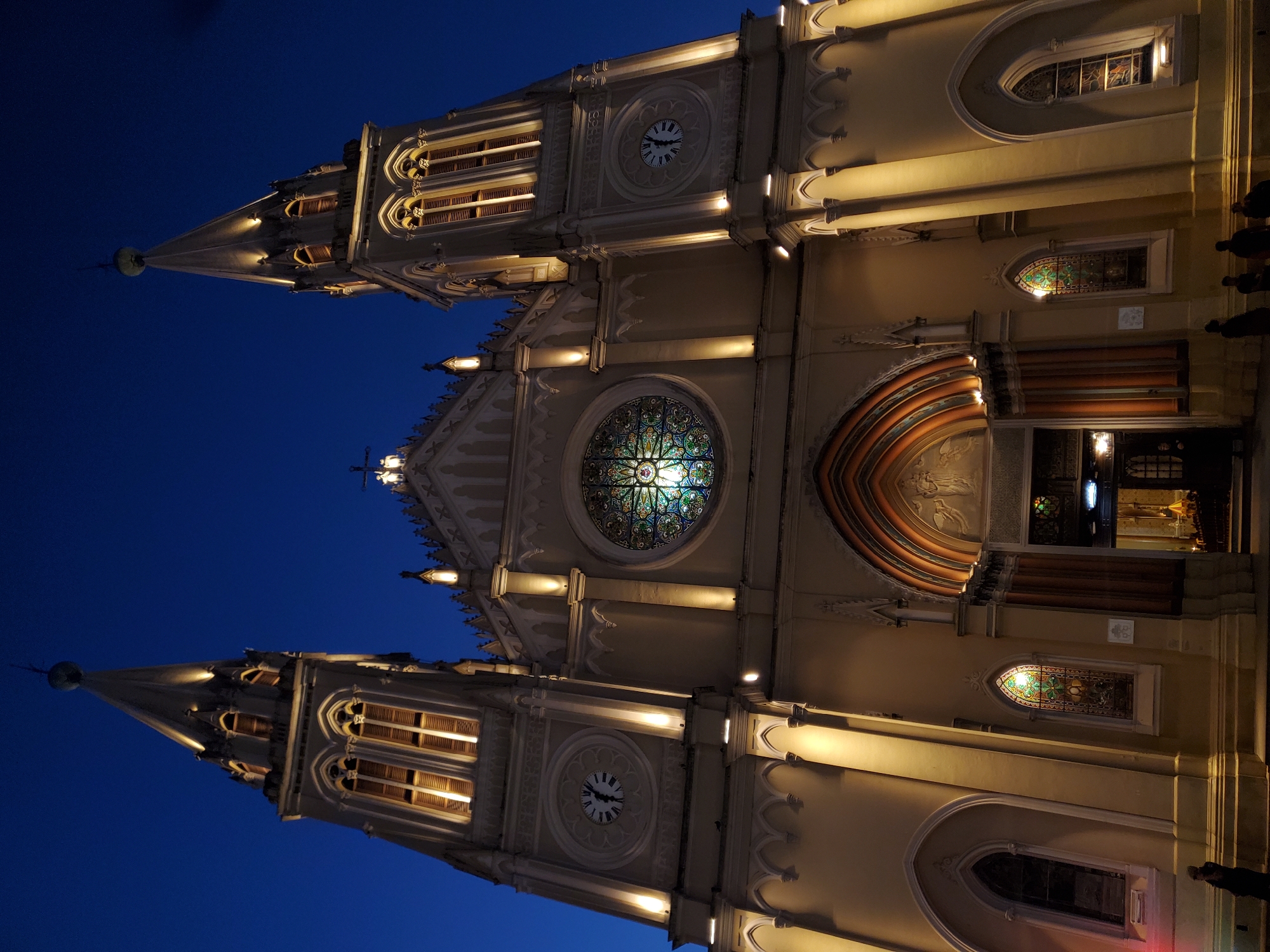 Dusk at Curitiba's cathedral square, mounted police patrolling nearby