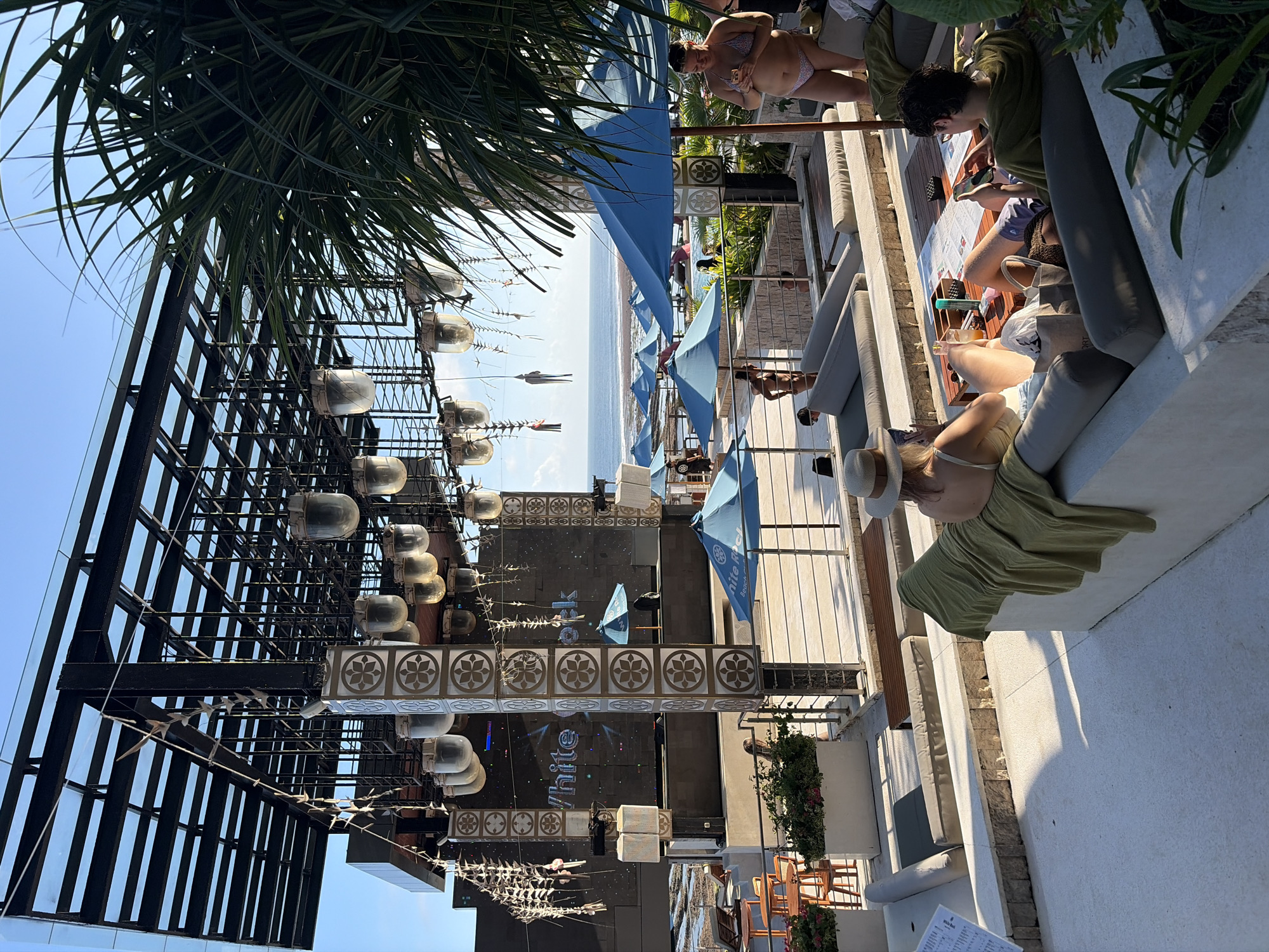 Daytime beach club event with dancers and ocean views, Kuta Selatan