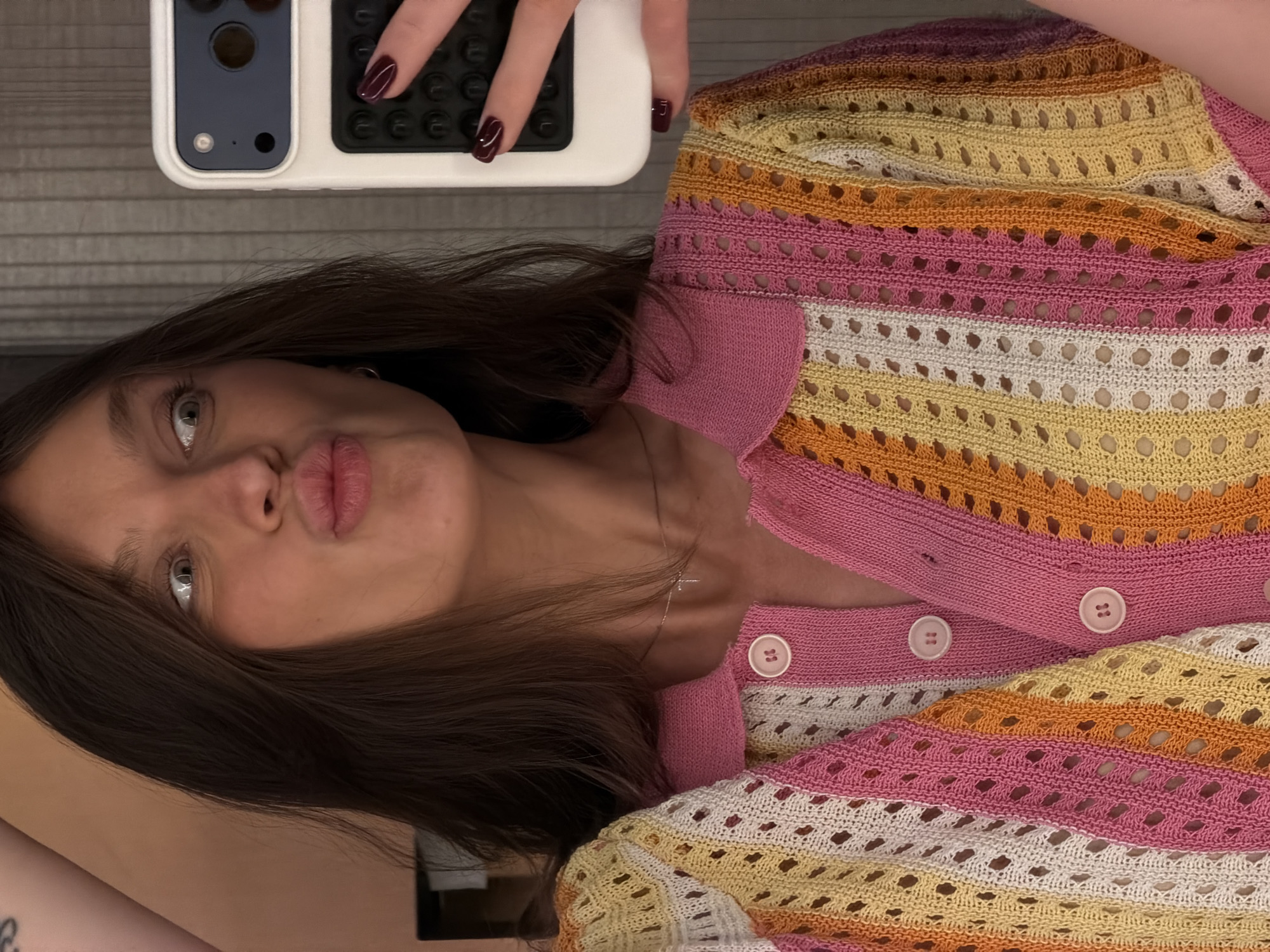 Mirror selfies in a Budva hotel room, colorful crochet top