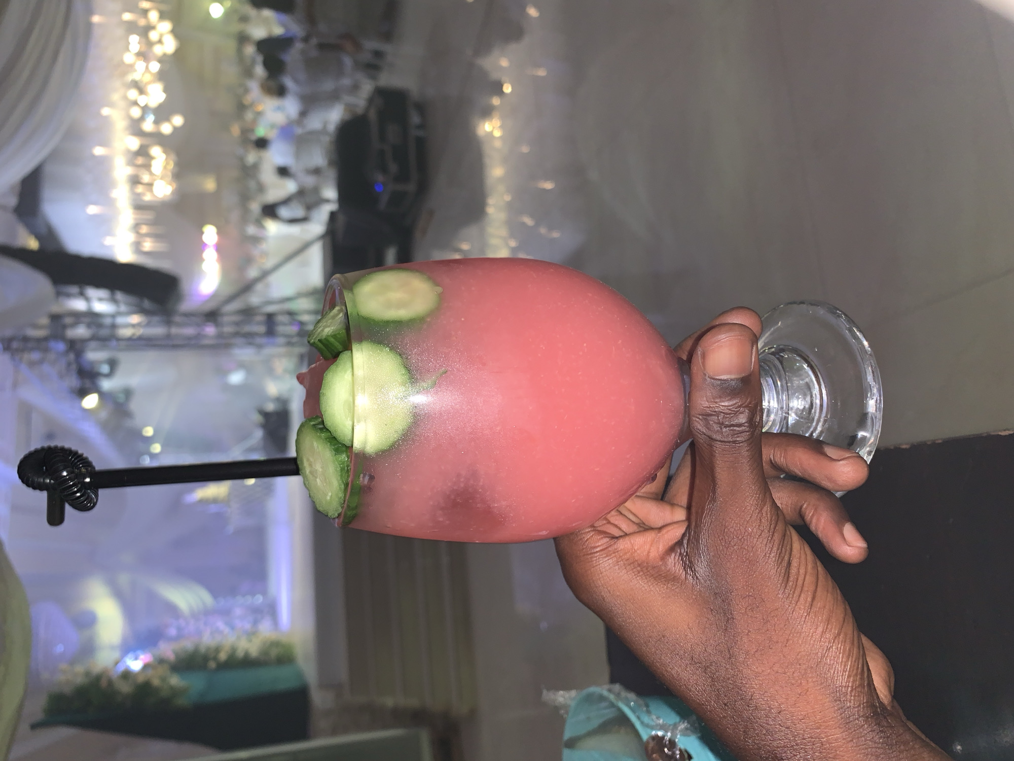 Colorful drinks and dressed-up guests at a Jos reception