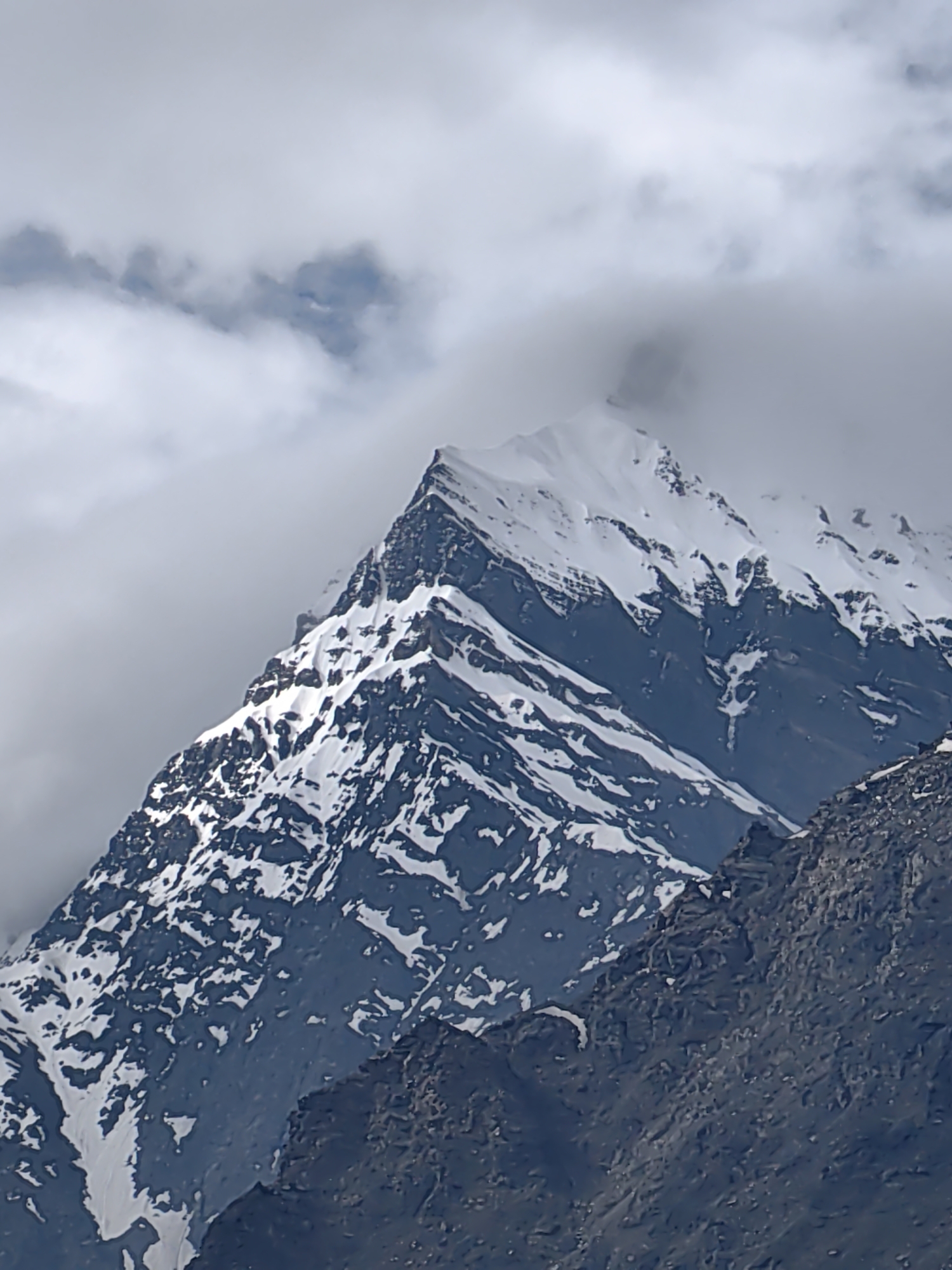 Snow-capped peaks and a hillside temple in Yamling, India