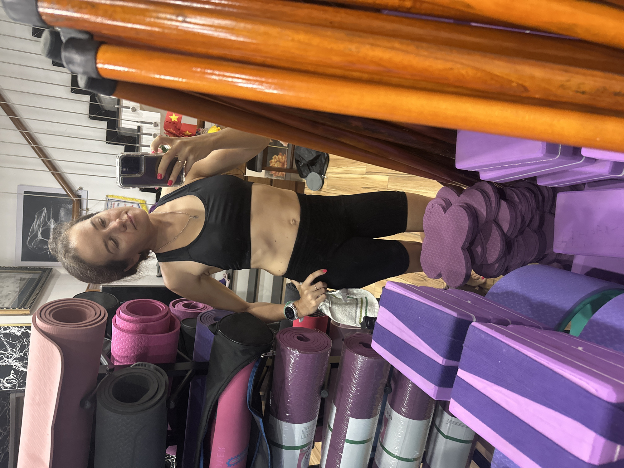 Woman takes selfies during yoga session in Vietnam studio