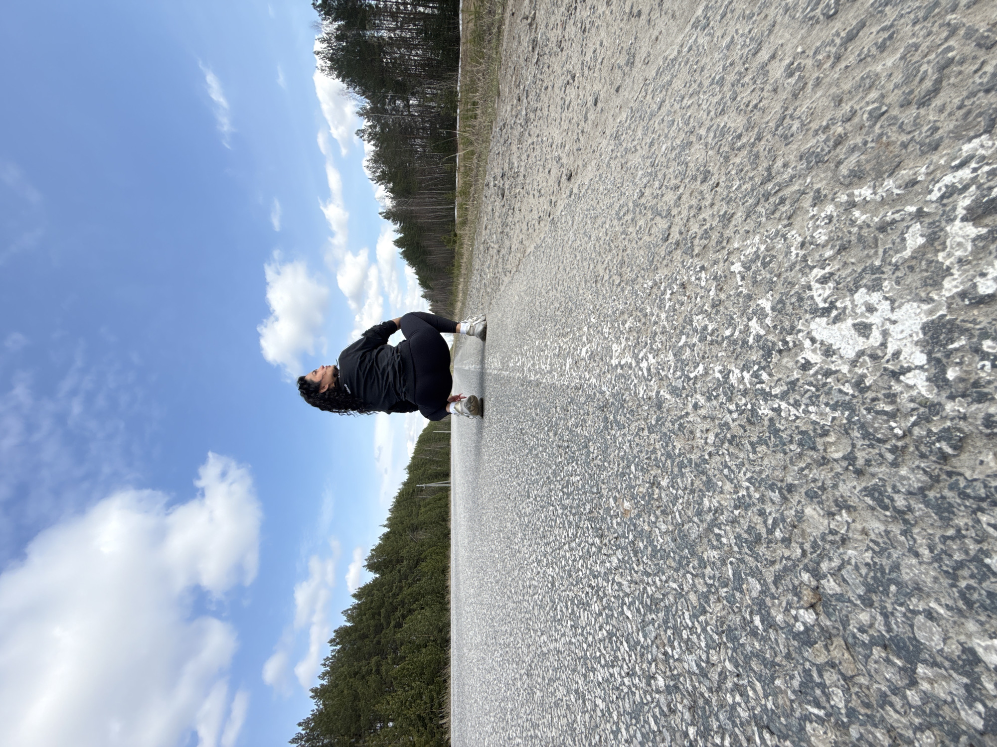 Woman poses for artistic photos on rural Russian road