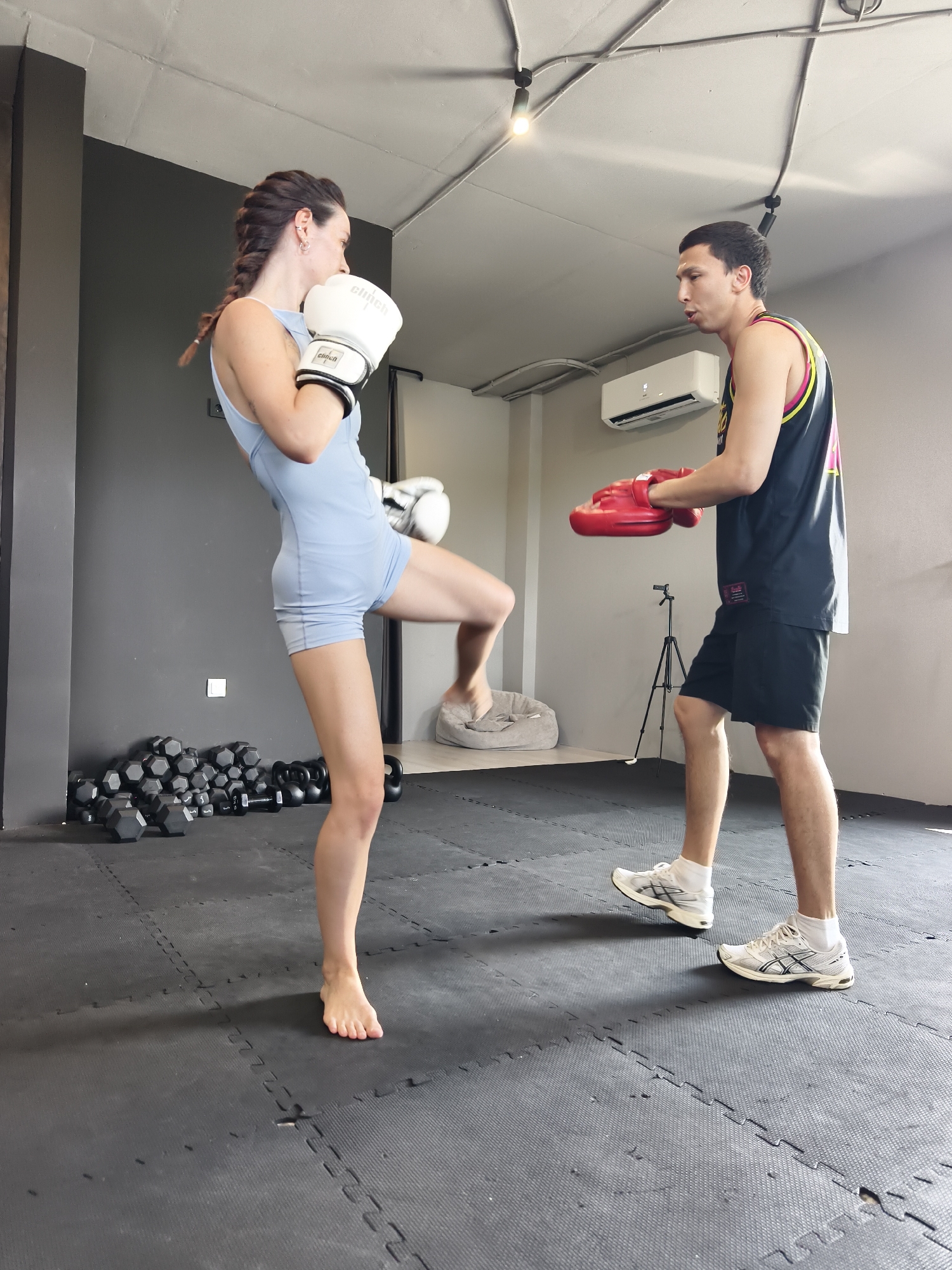 Kickboxing and pad work training session at a Tyumen gym