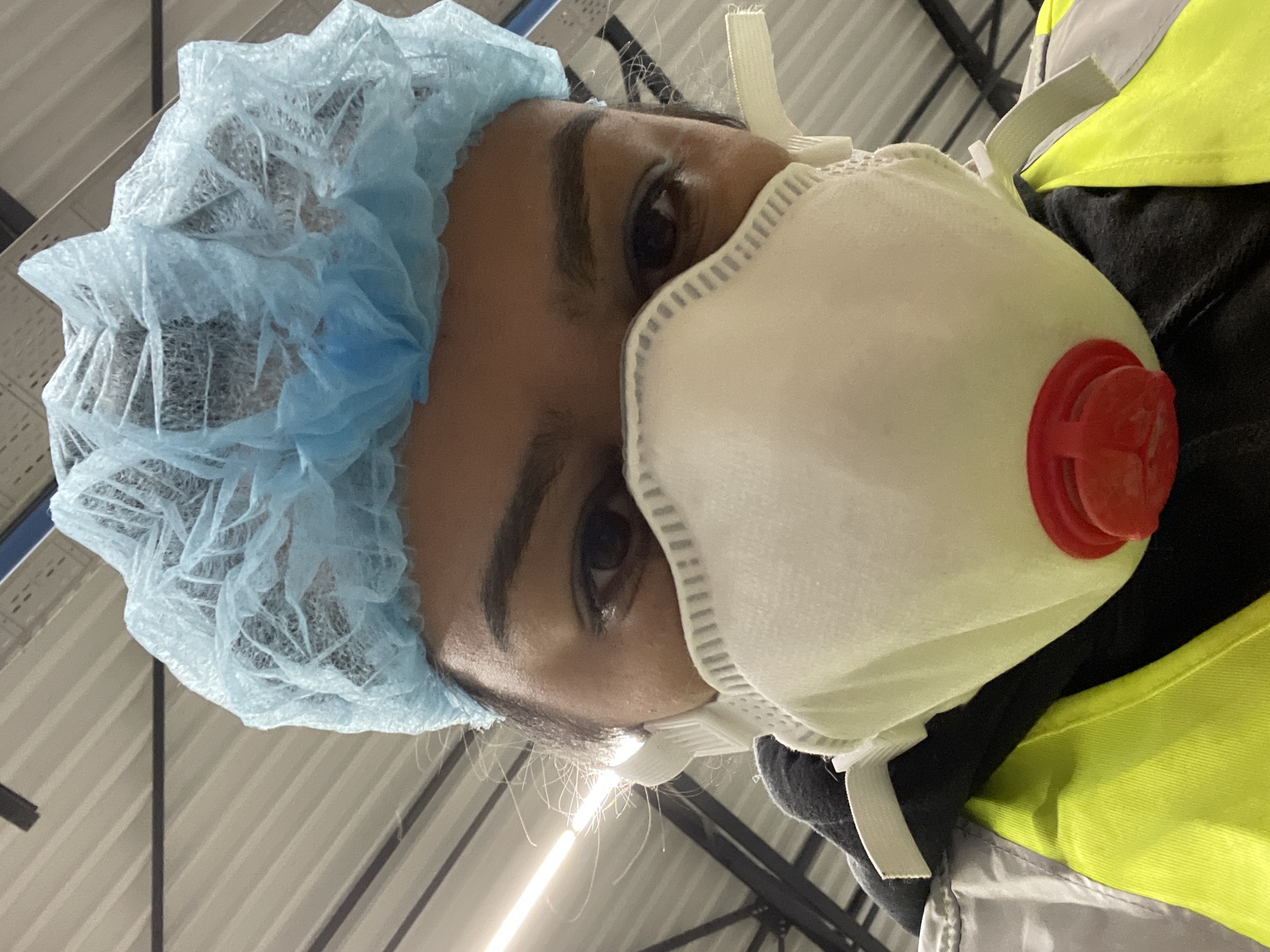 Industrial workers in protective gear observed in Kampen