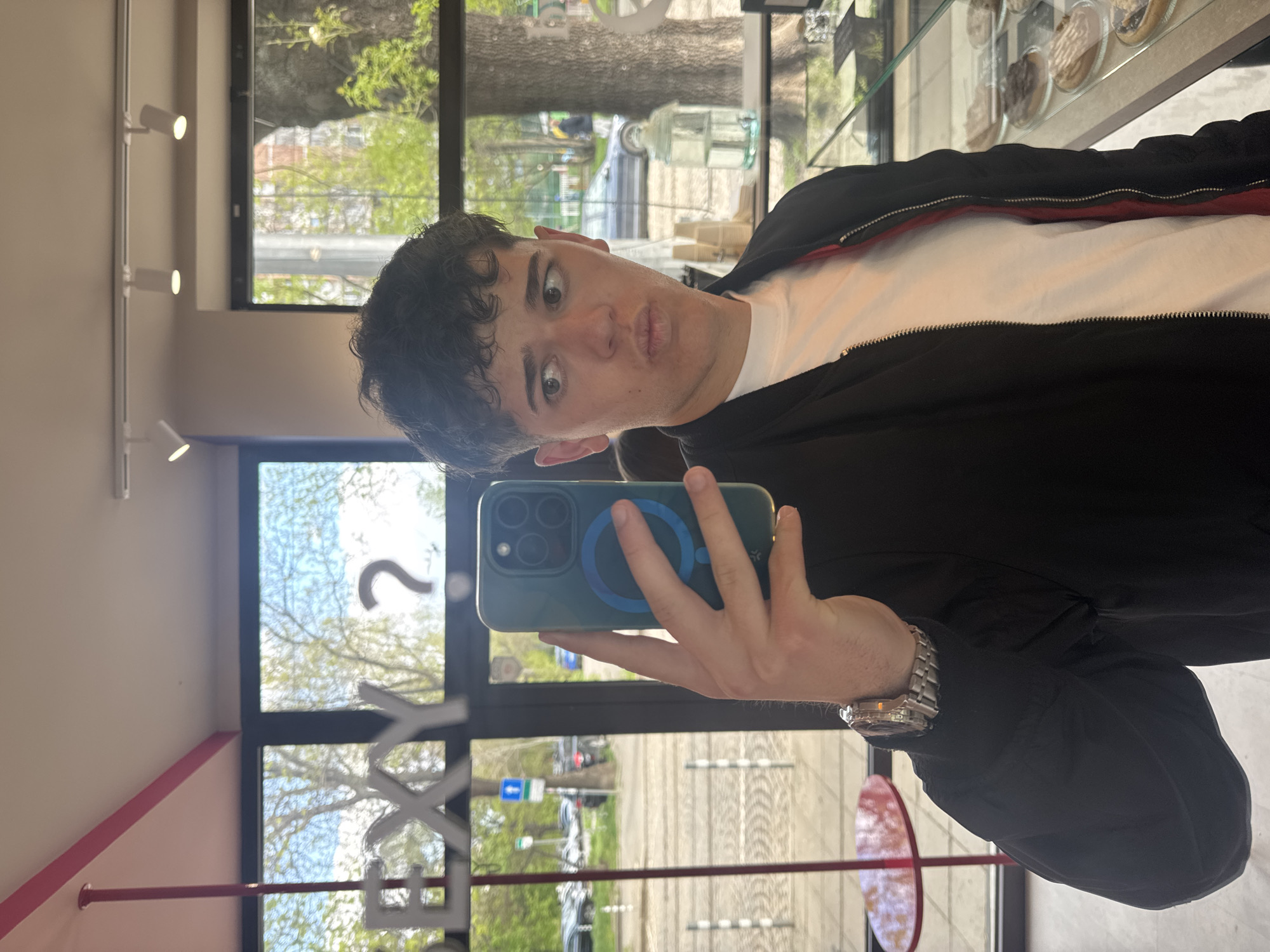 Customer takes selfie at Sofia cafe while browsing pastries