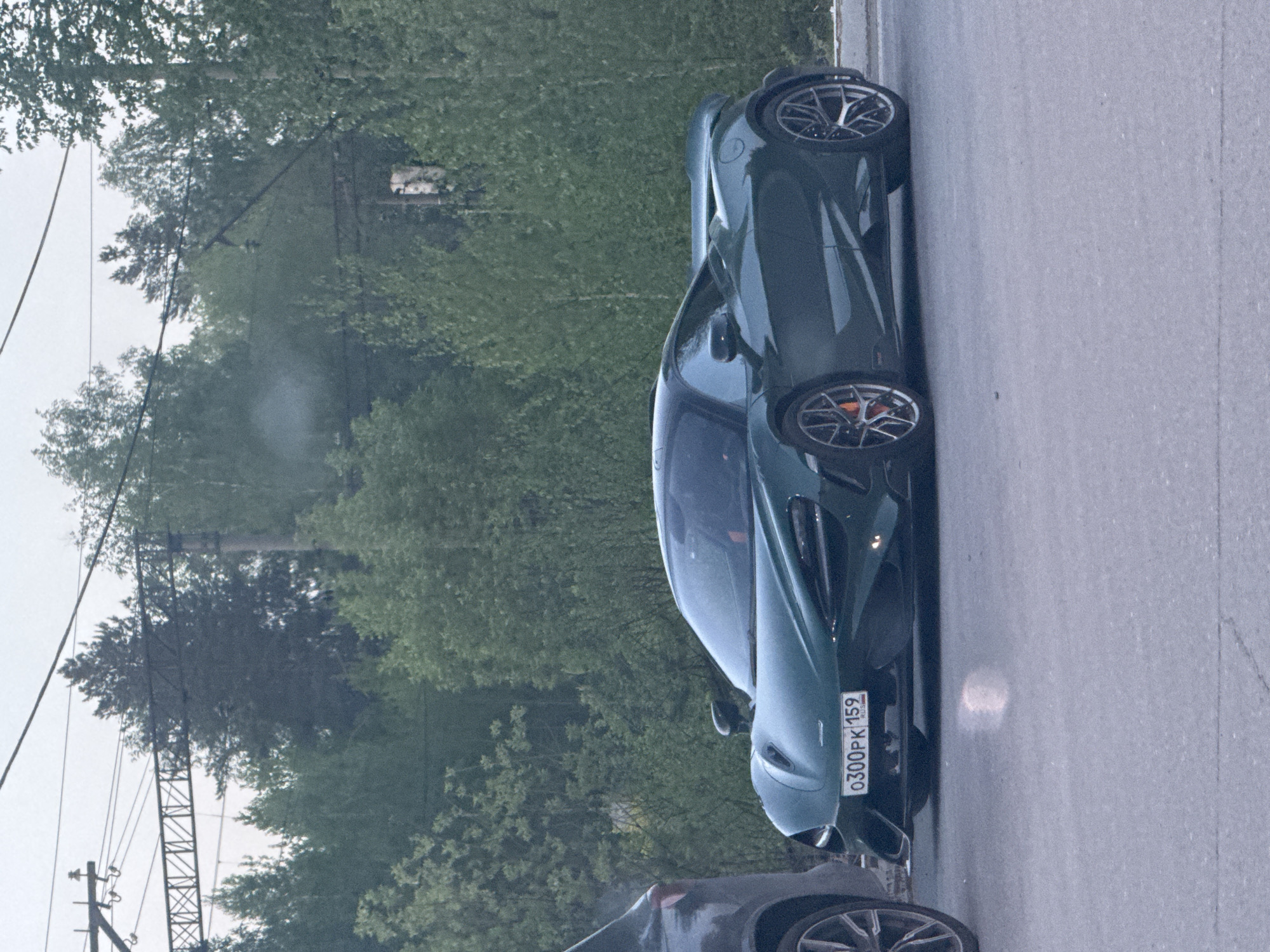 Green McLaren sports car spotted parked in Perm, Russia