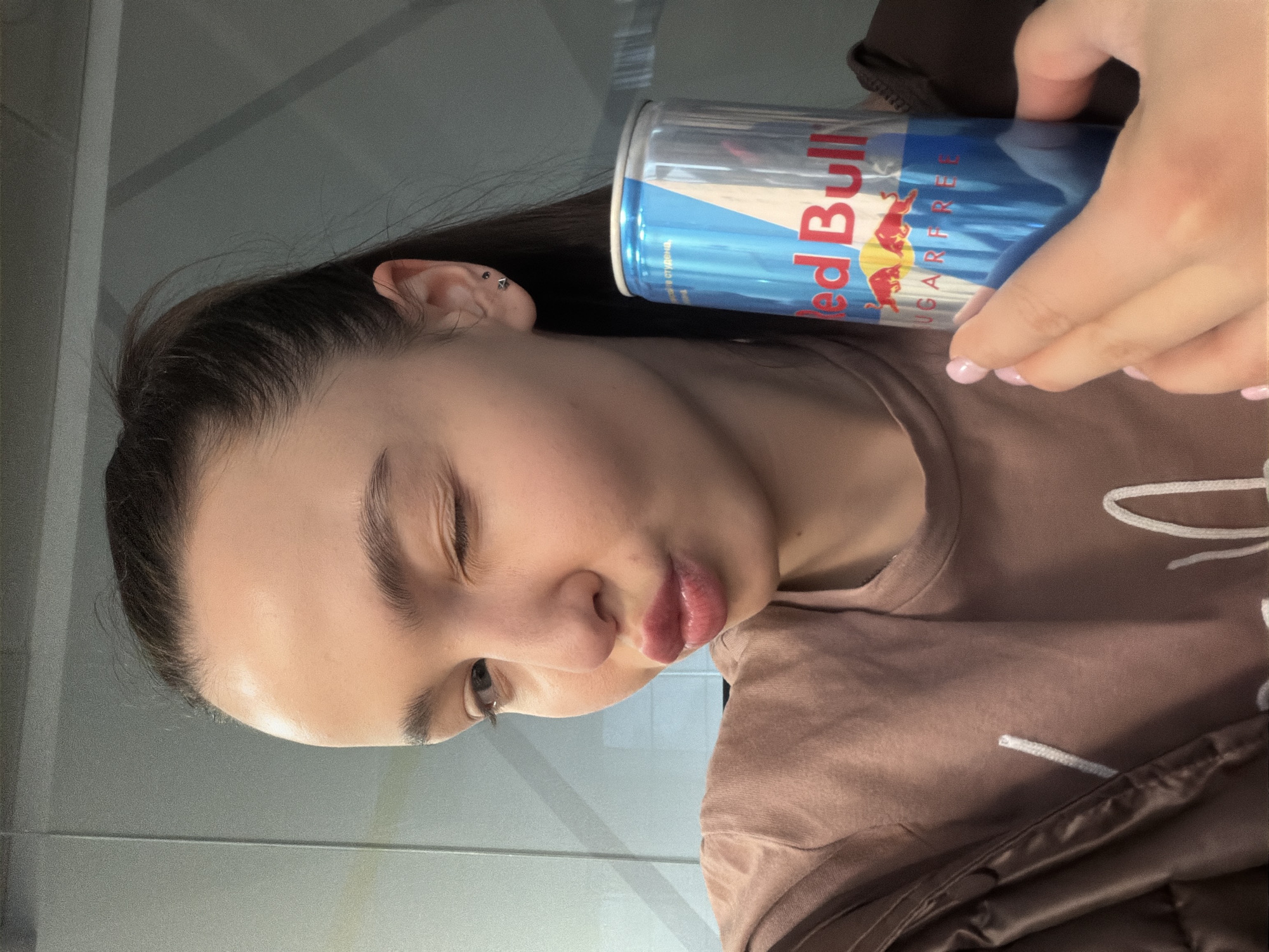 Woman takes early morning selfies with energy drink in Sofia
