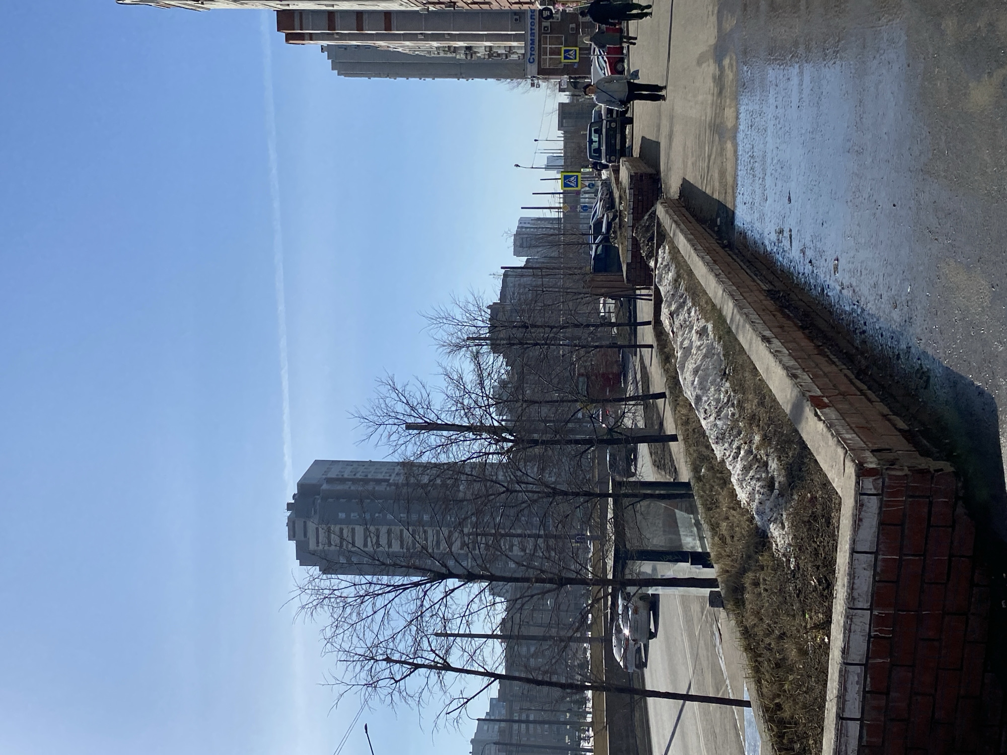 Clear morning sky with contrail over Kazan residential street