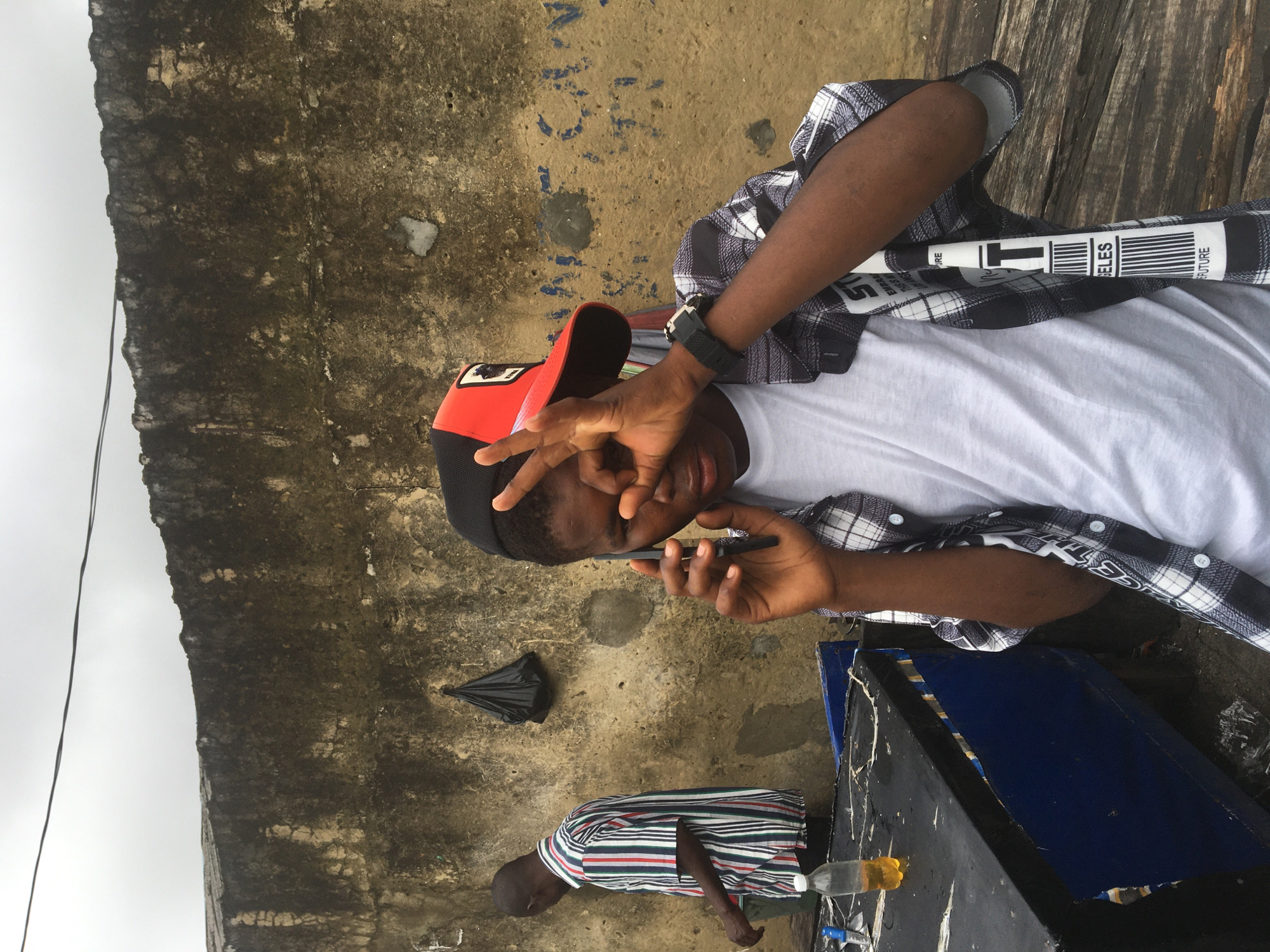 Casual morning hangout in a courtyard in Ado, Nigeria