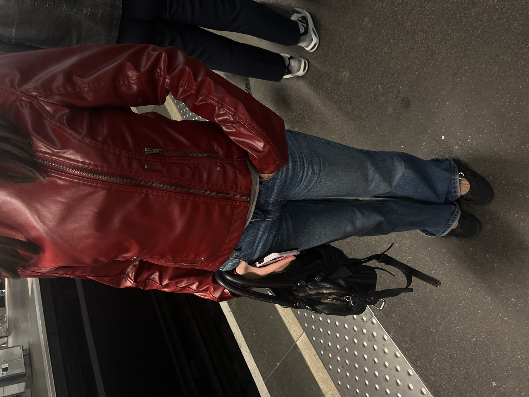 Passengers wait on Lyon Metro platform during midday transit