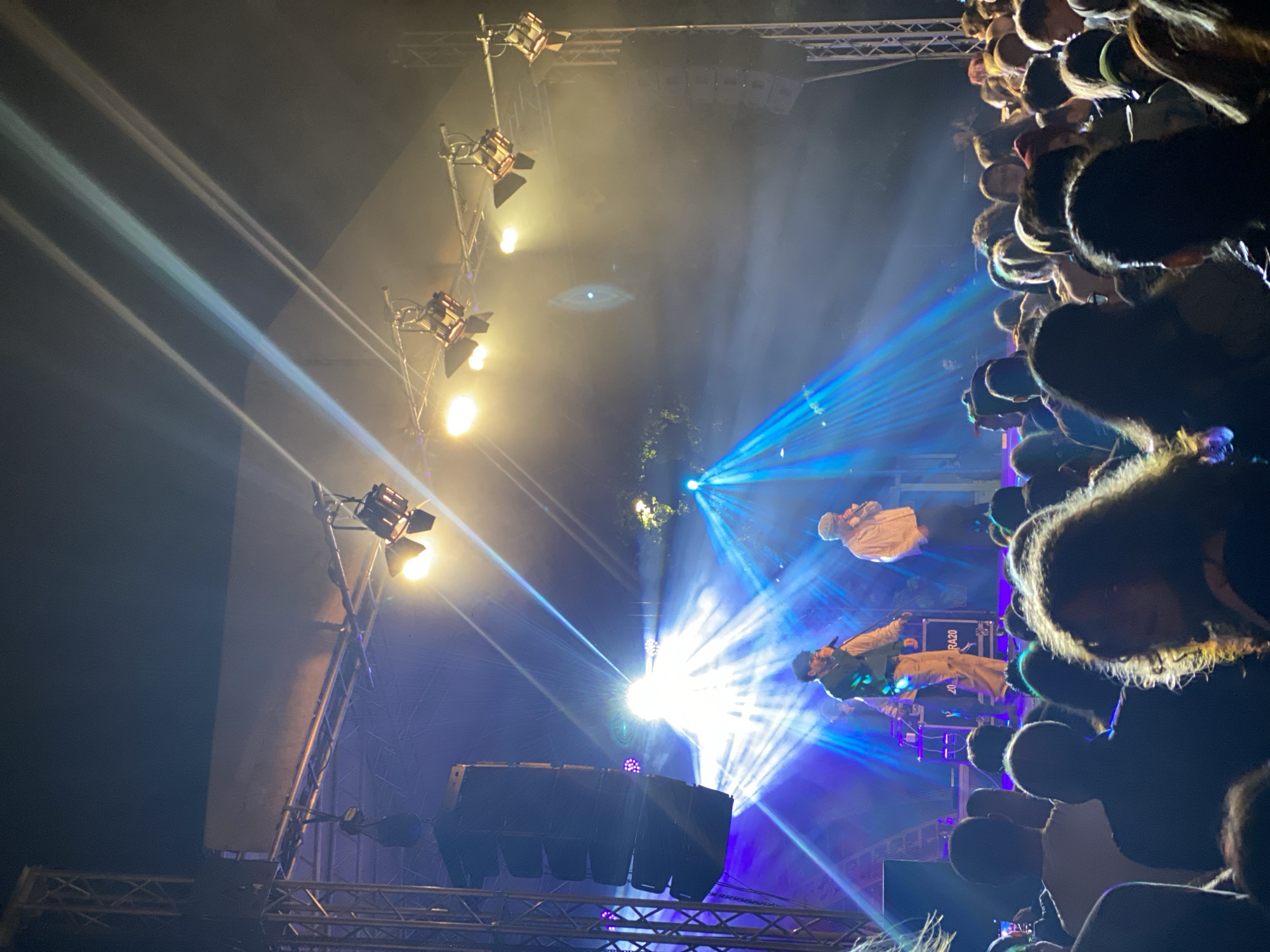 Nighttime concert draws crowd with colored stage lighting