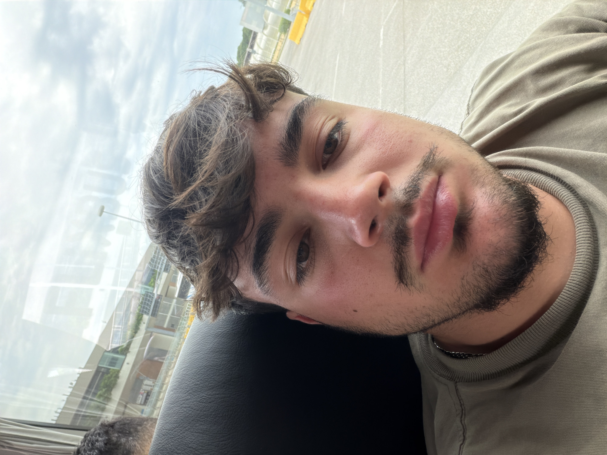 Young man photographed in vehicle seat in Venice
