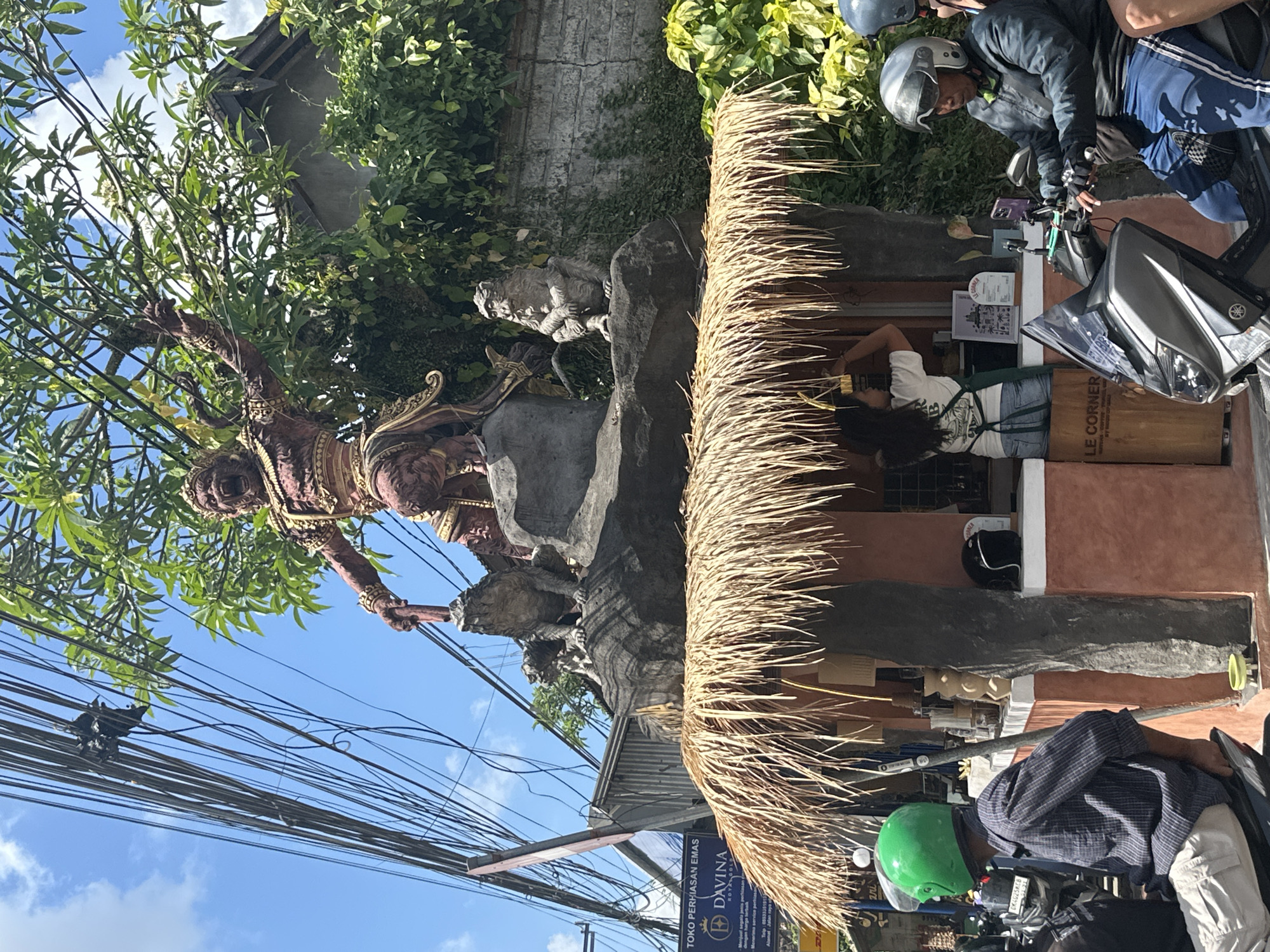 Street-level tour through Ubud's temples, traffic, and traditional decor