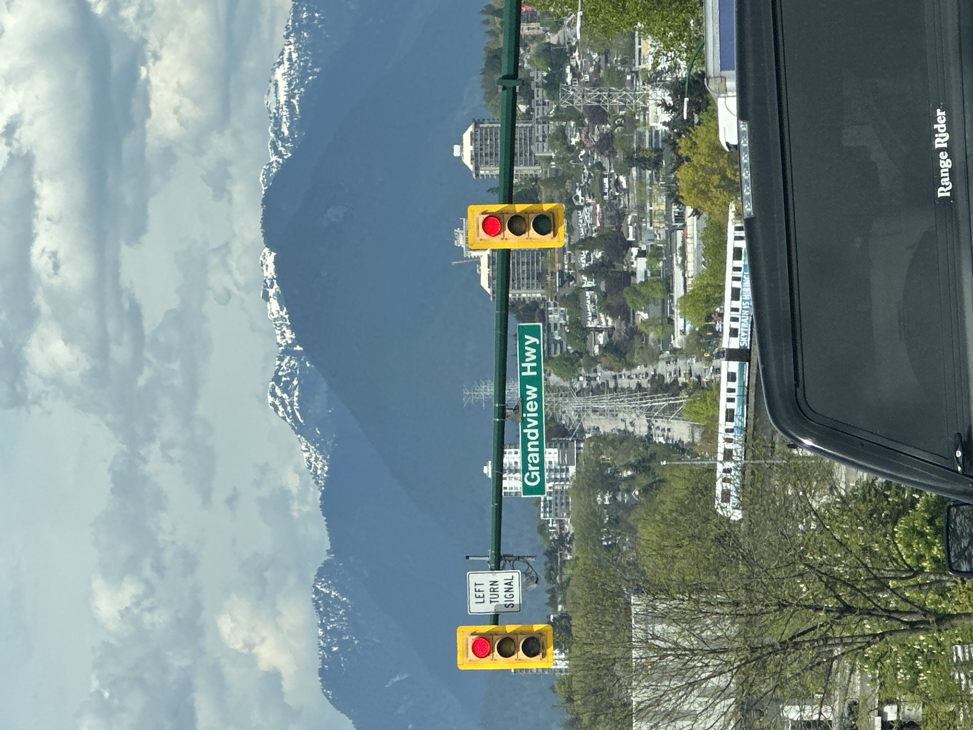 Urban Vancouver scene captured from vehicle during daytime