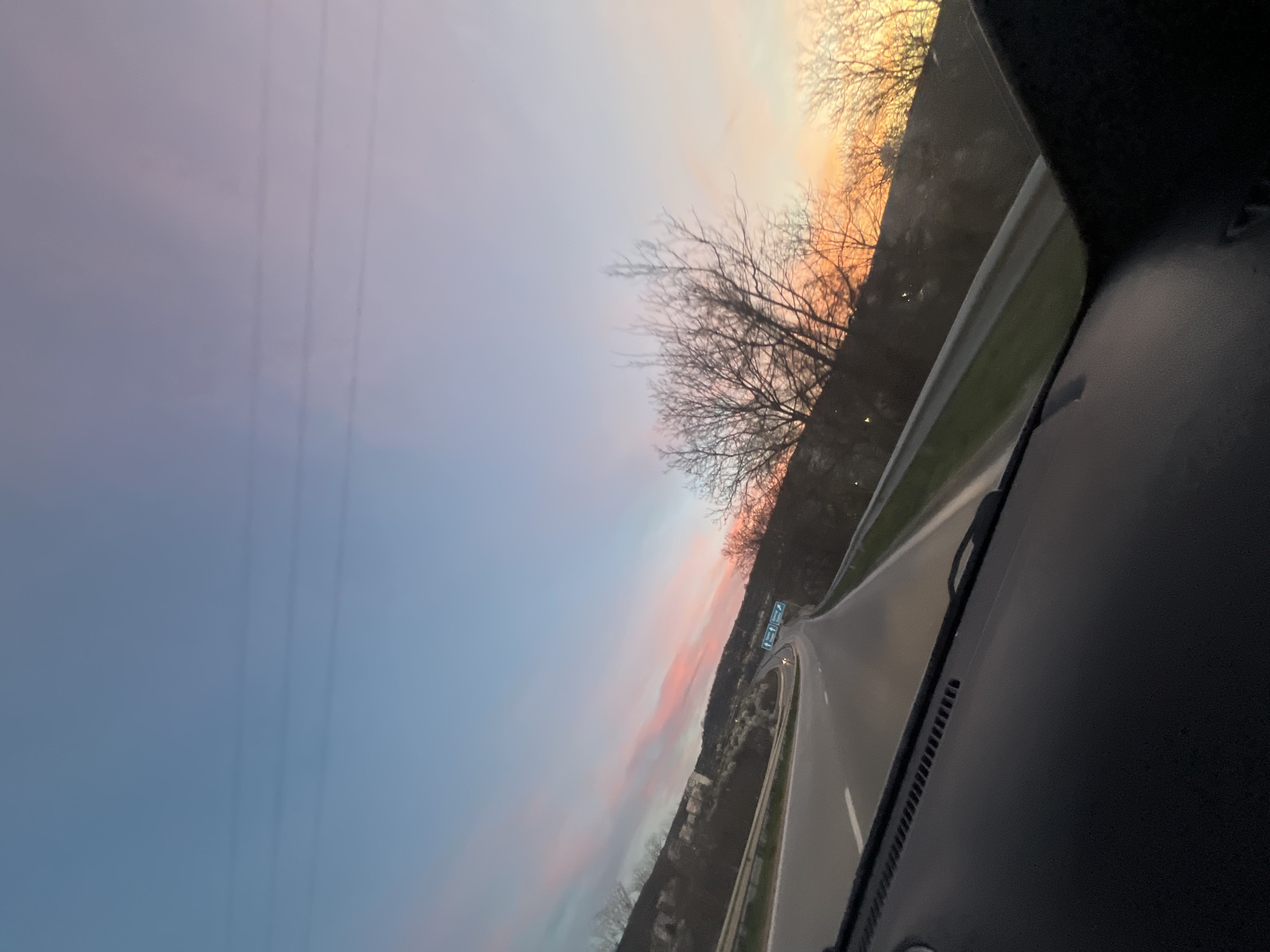 Vehicle travels curved highway near Lovech during sunset