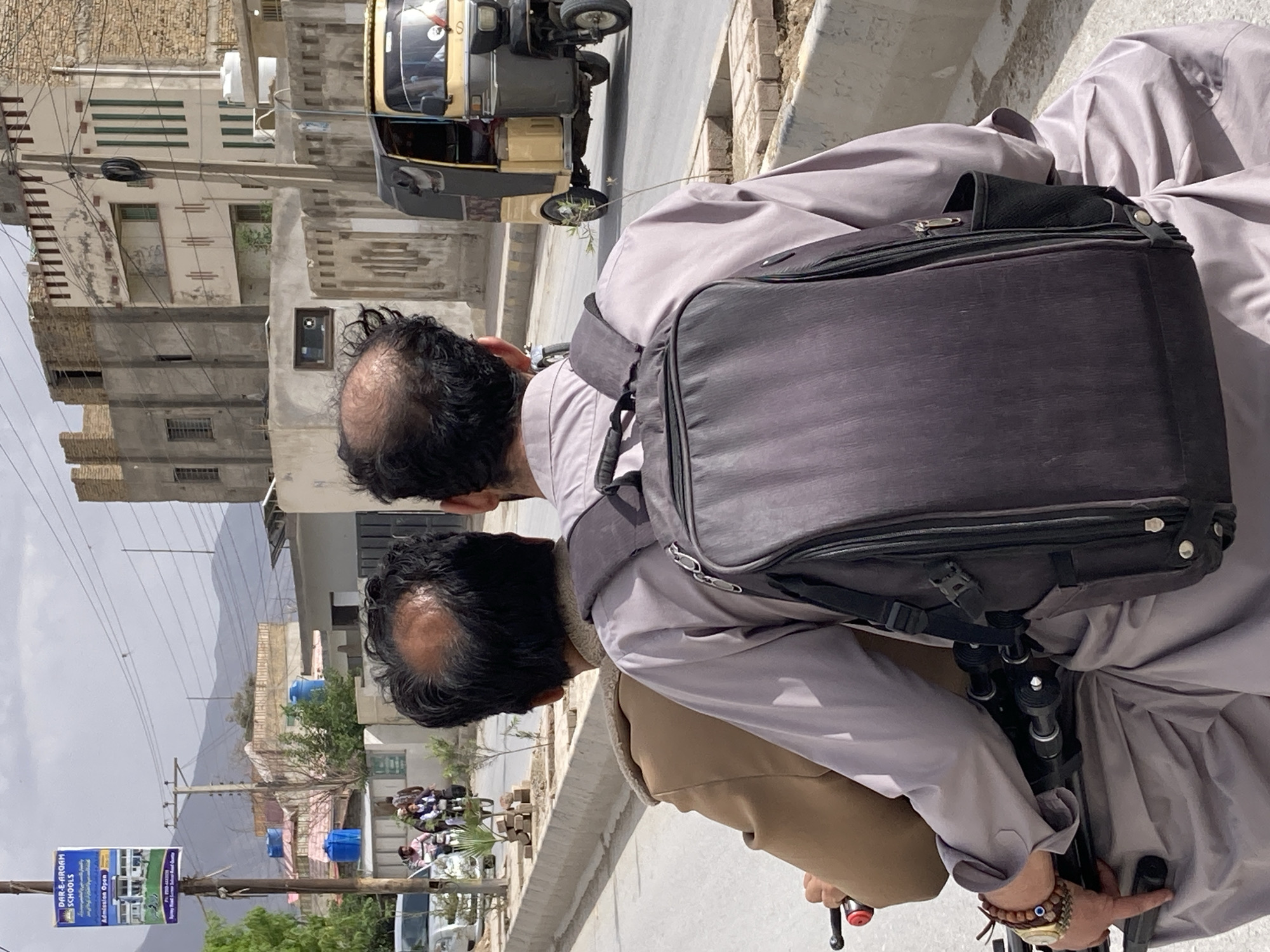 Two men spotted on Quetta street during overcast day