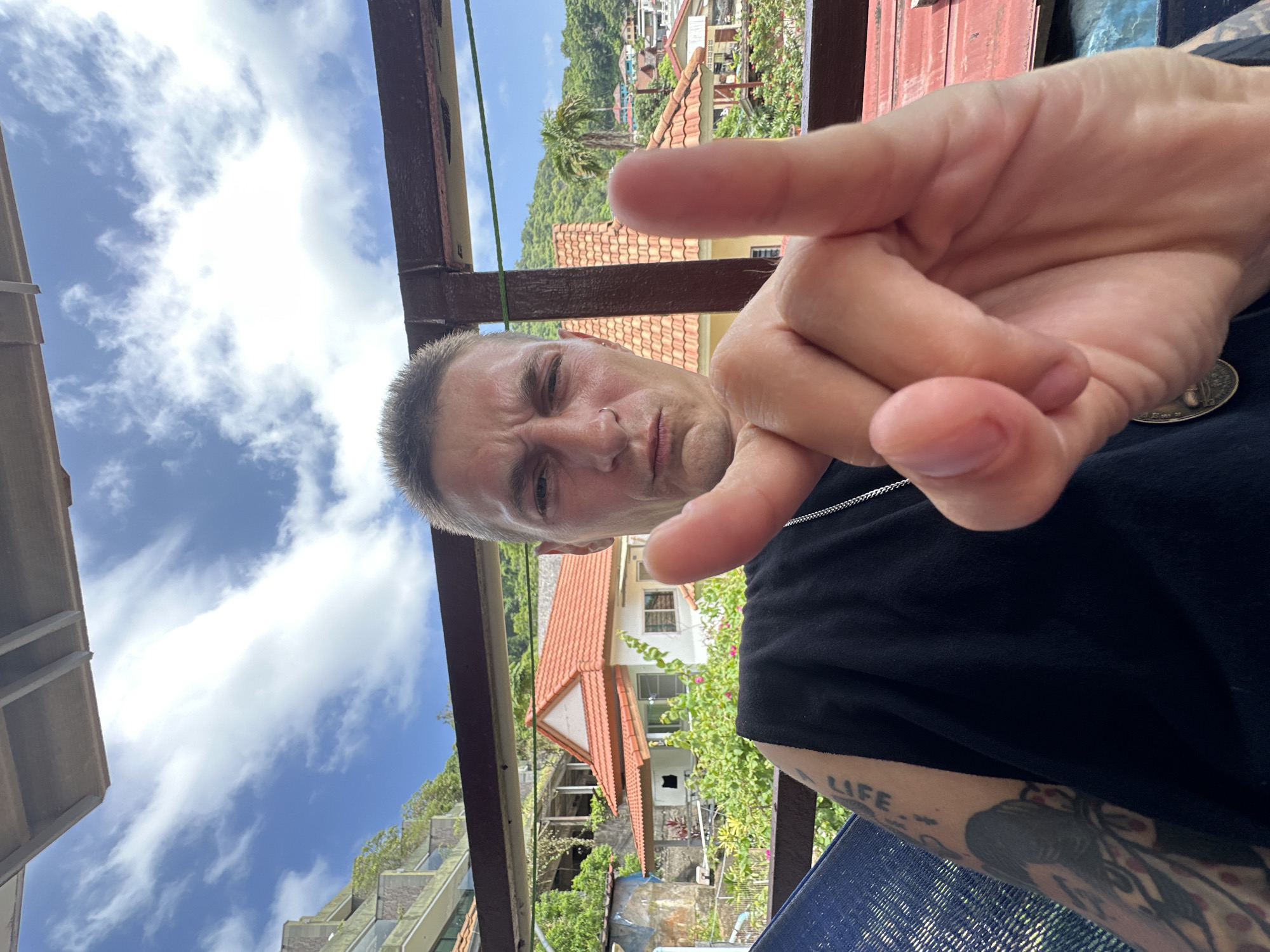 Lazy balcony morning in Karon, tattoos and rooftop views