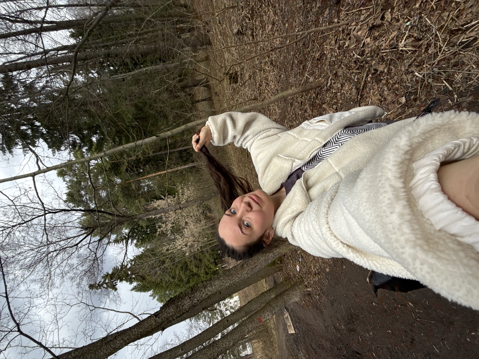 Woman photographed in forest setting during brief outdoor session