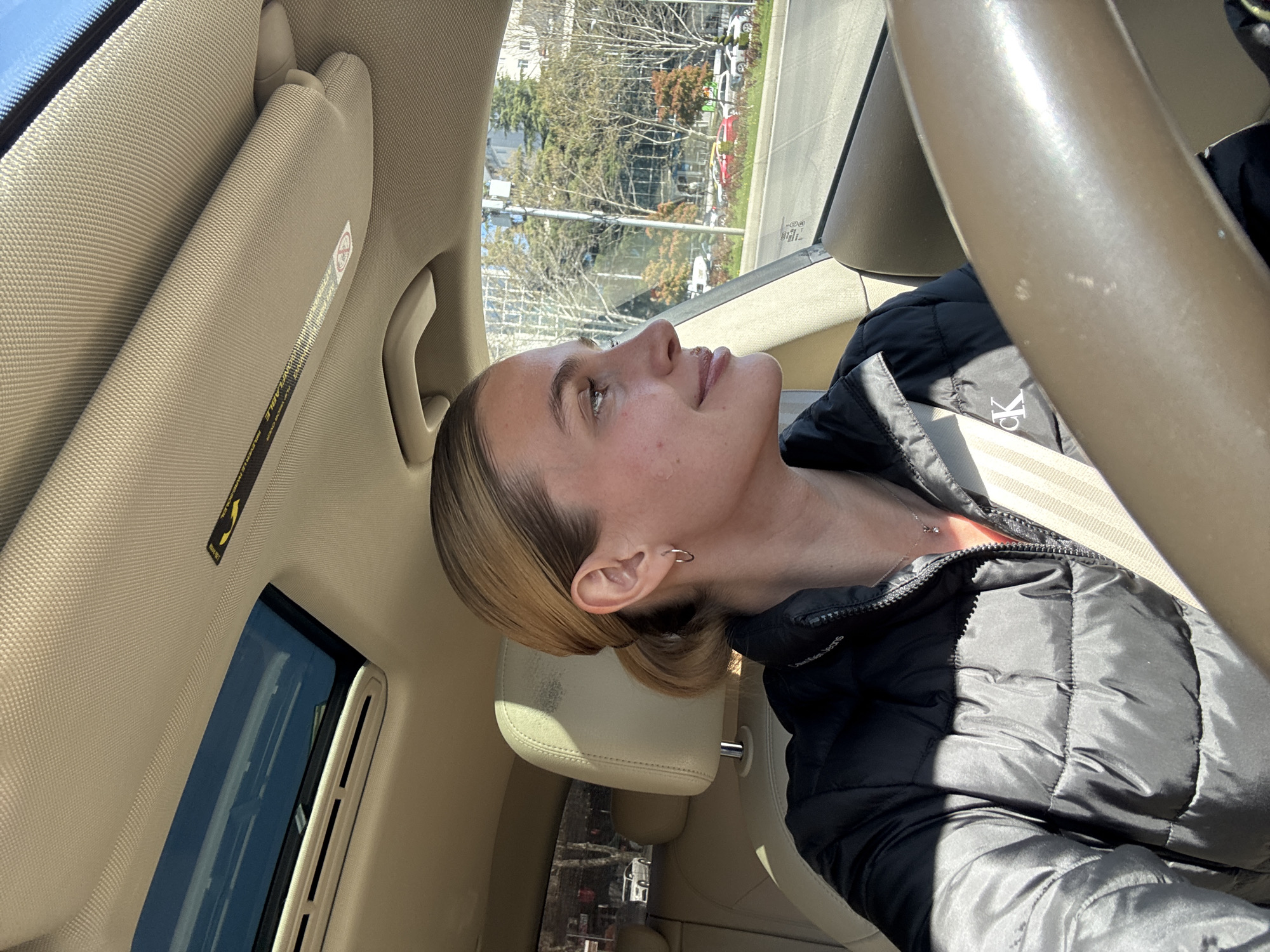 Woman in black jacket observed driving, walking in Tbilisi
