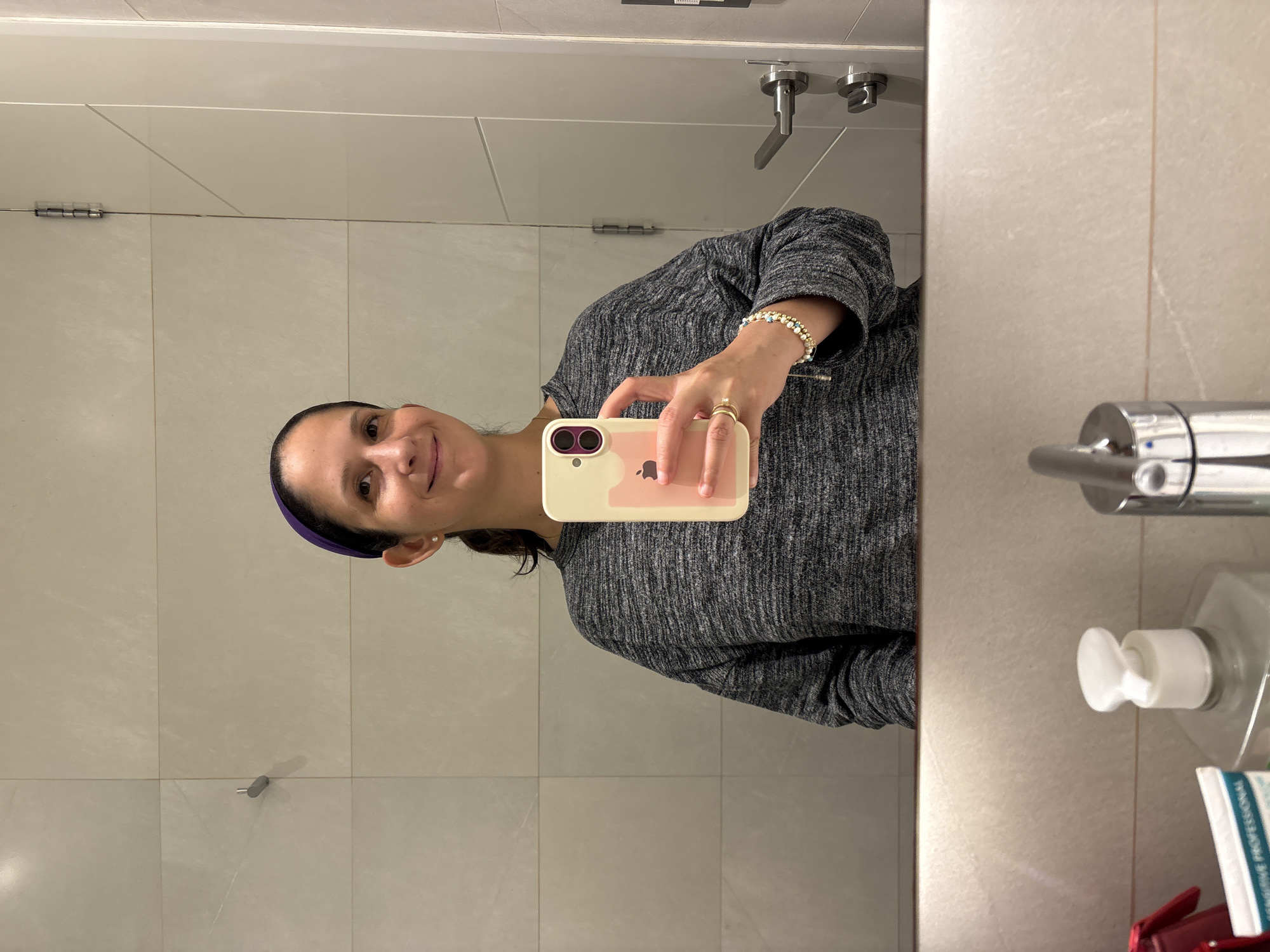 Woman Takes Bathroom Mirror Selfies in San Isidro