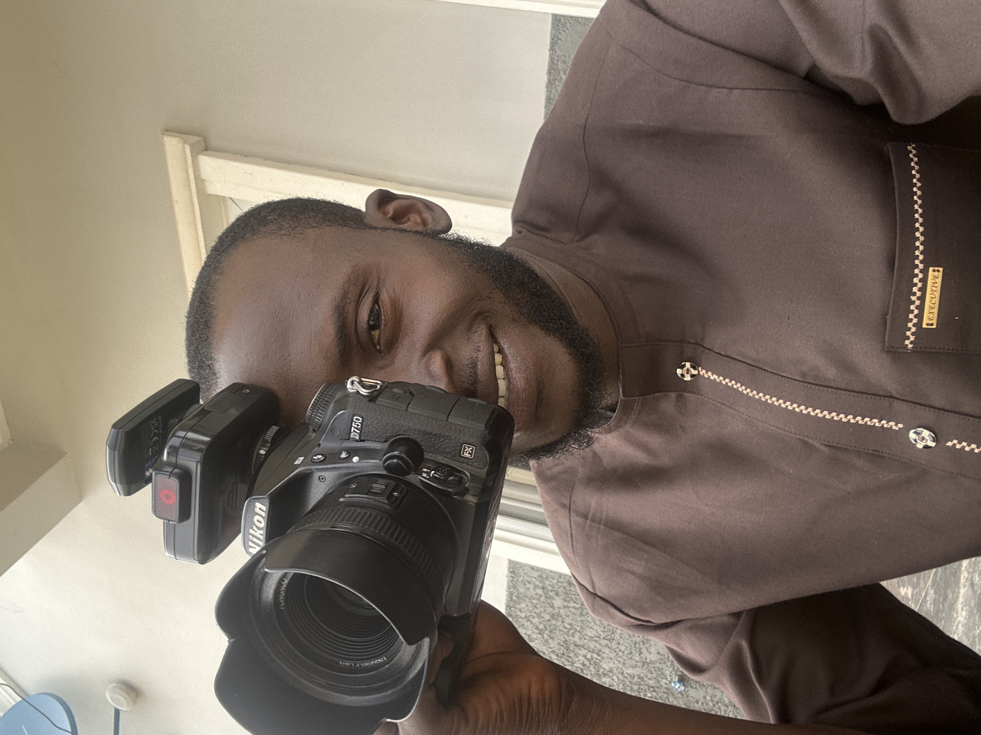 Portrait session underway in Jos, Nigeria, cameras and phones out