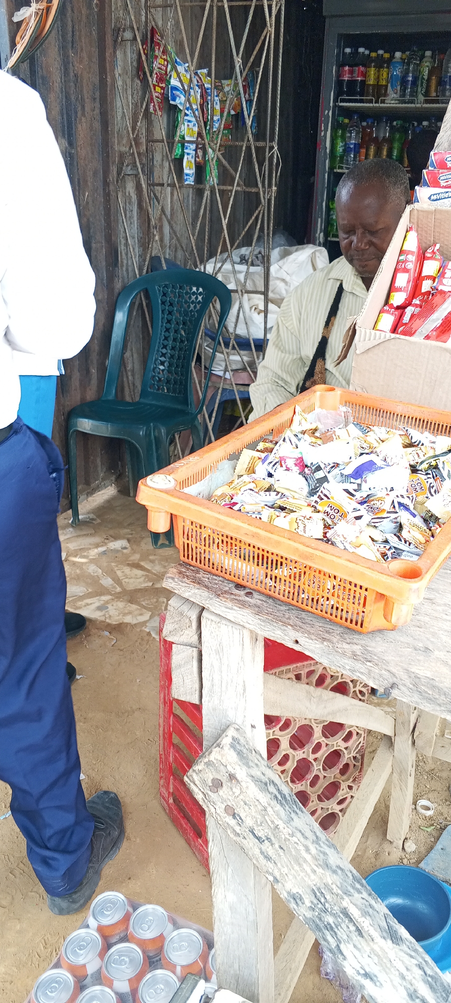 Street vendors serve students at roadside market in Keffi