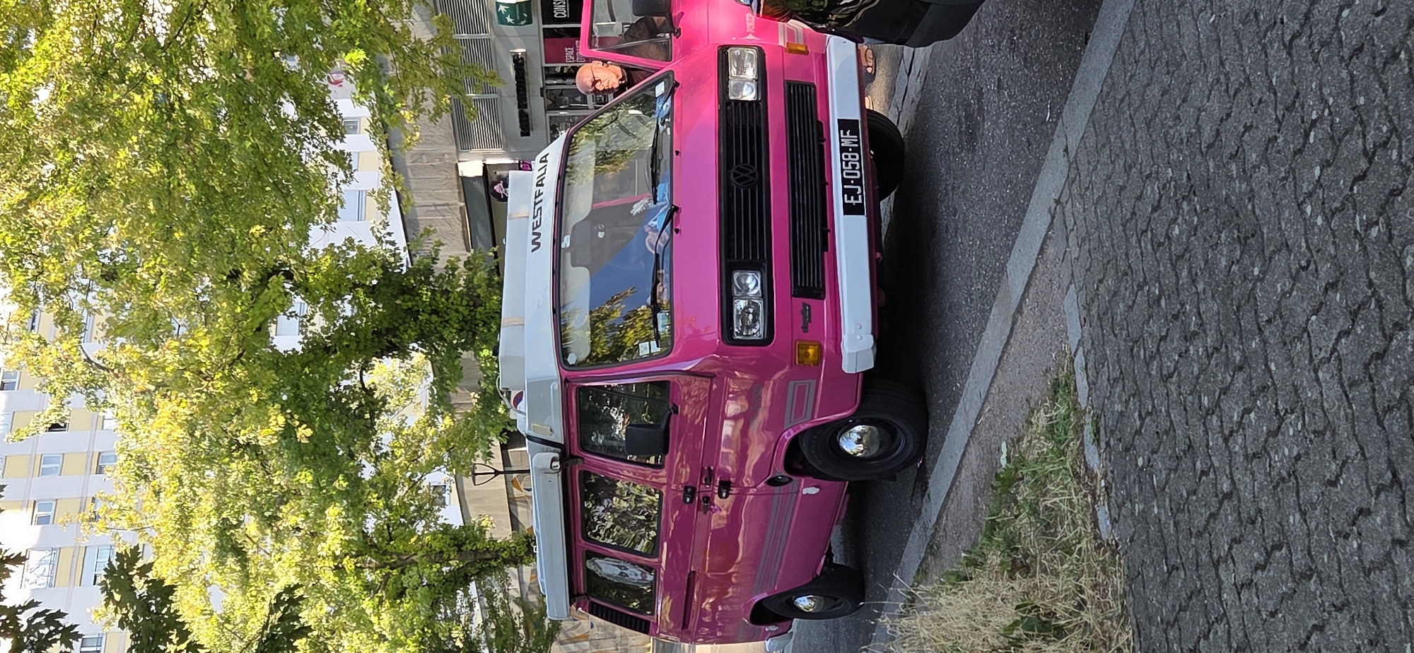 Bright pink Westfalia camper van parked in Strasbourg