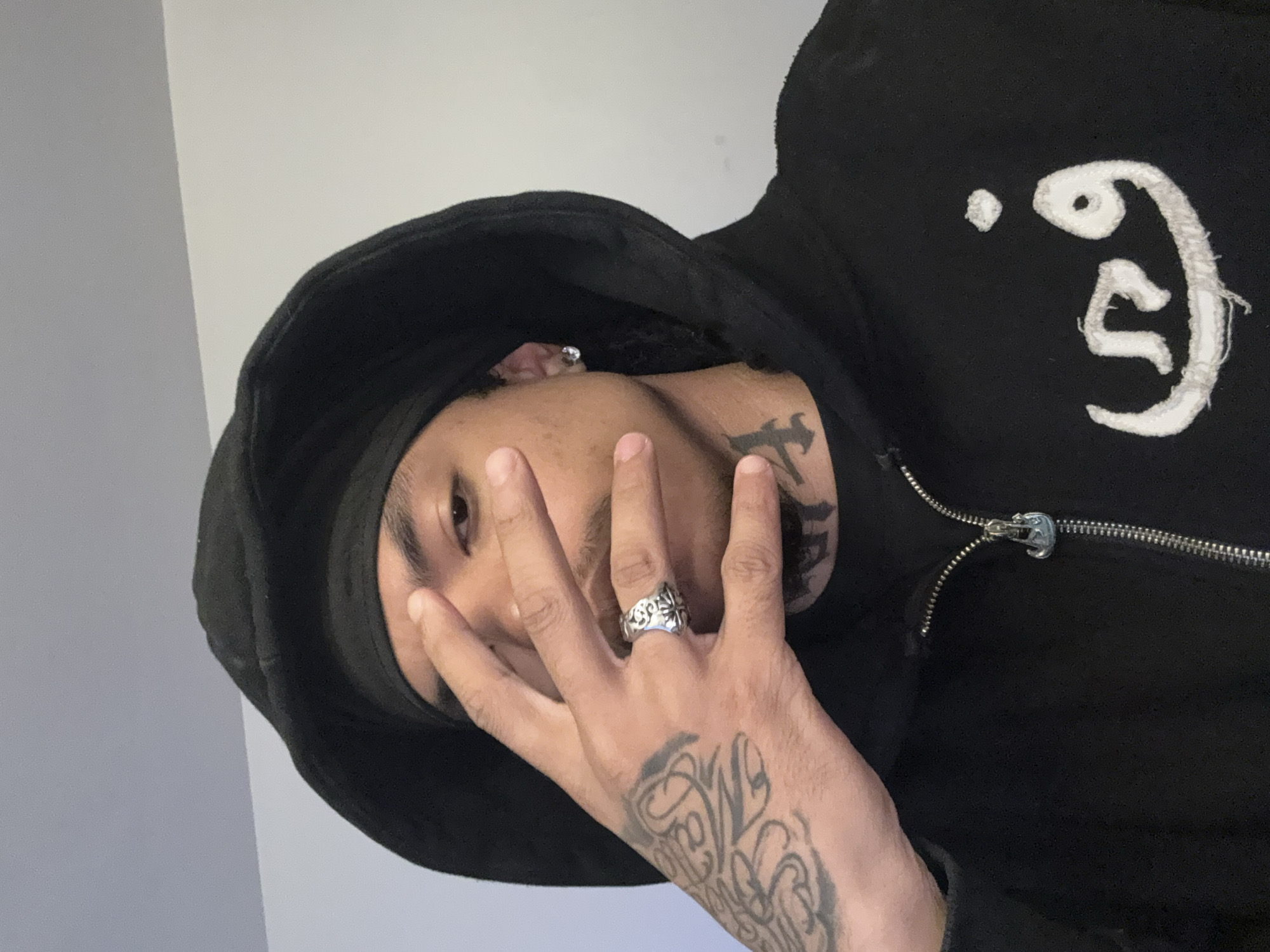 Person in black hoodie observed indoors in Massy, France