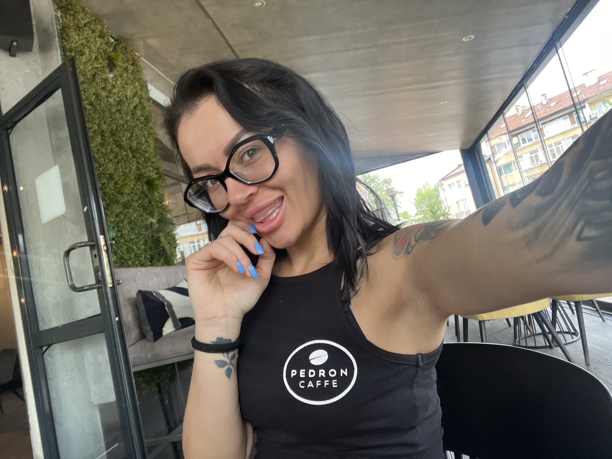 Woman photographed at cafe and outdoors in Aytos, Bulgaria