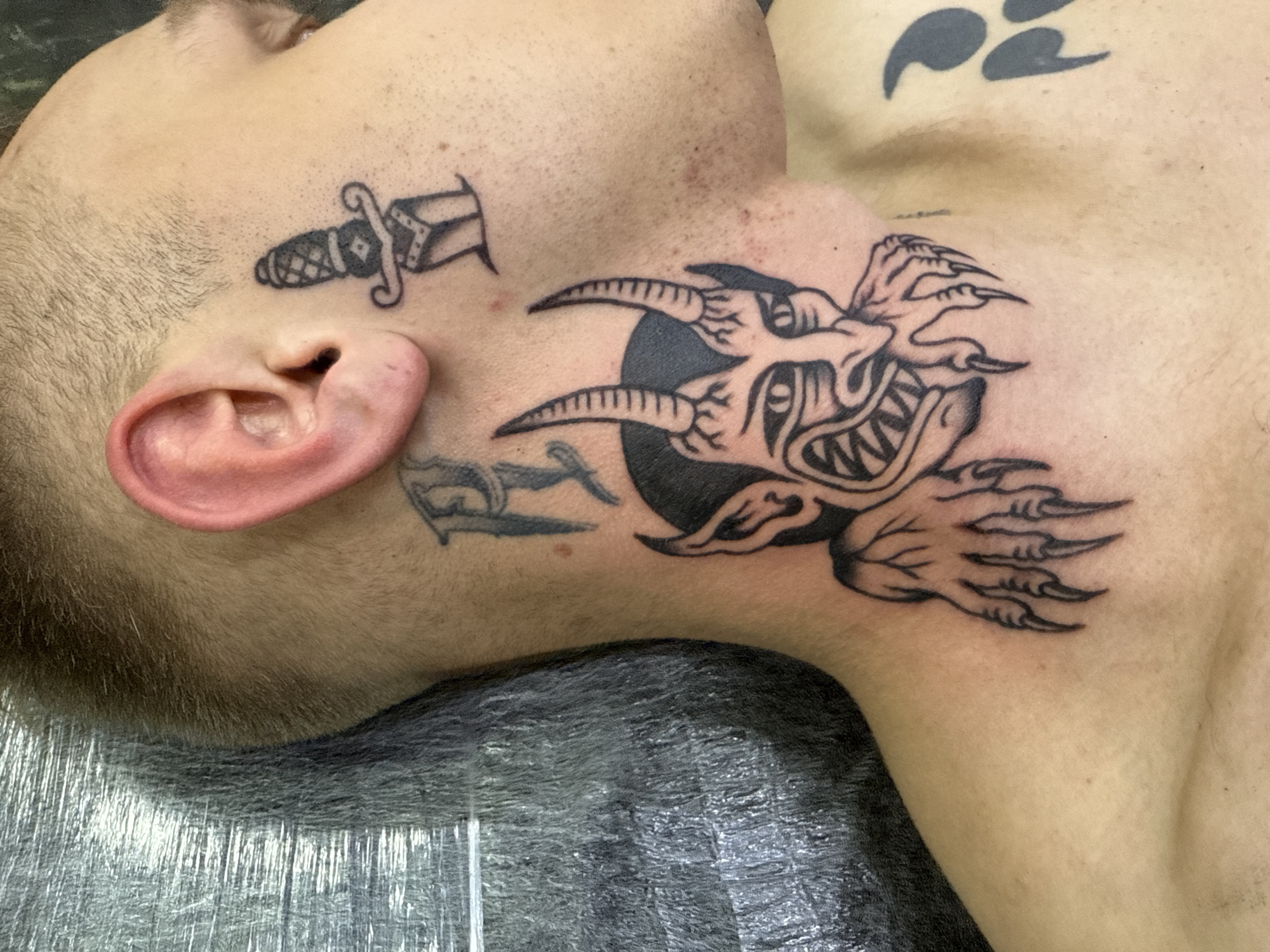 Tattooed man photographed in close-up shot in Moscow