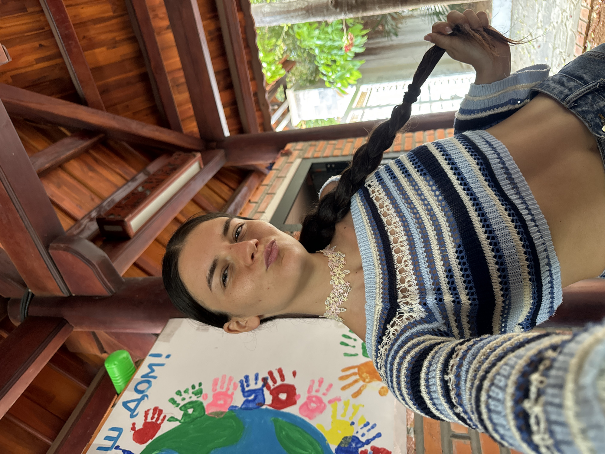 Woman's casual moments documented with child, kitten in Mũi Né