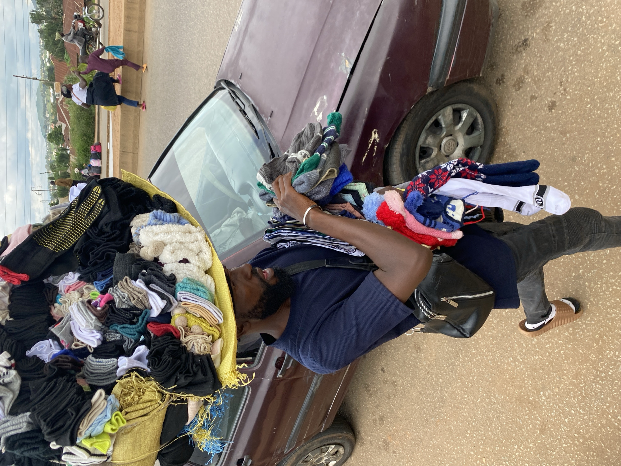 Midday street life and market activity in Bukuru, Nigeria
