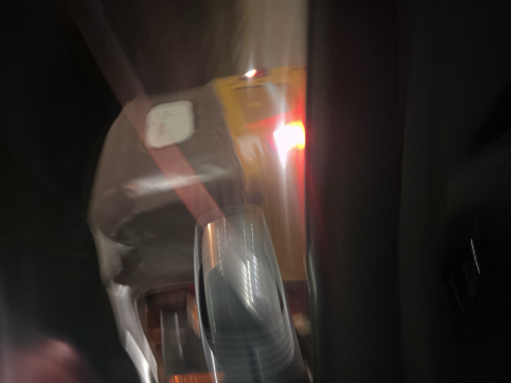 Yellow tricycle captured in motion during nighttime in Abuja
