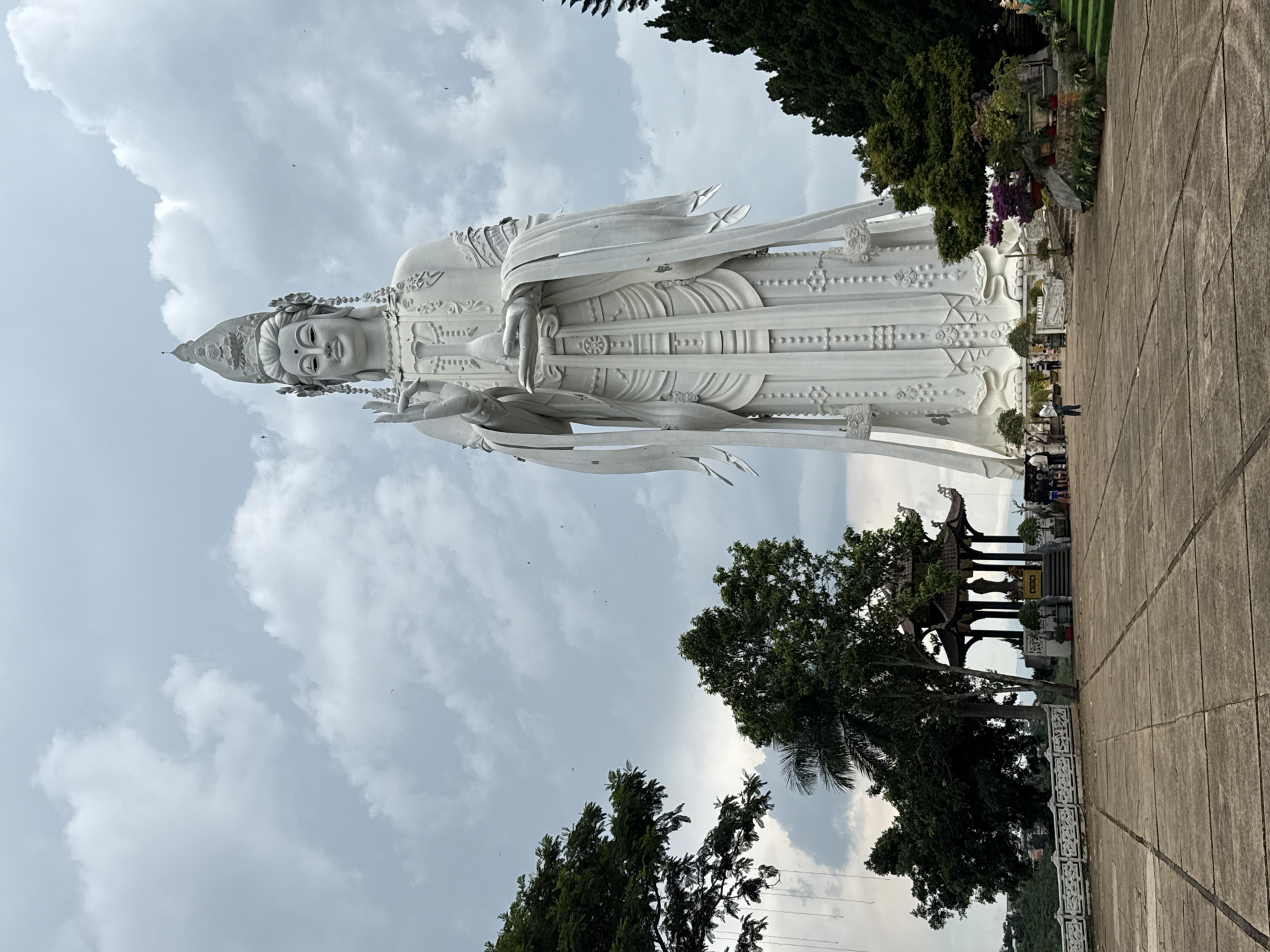 Buddhist statues and waterfalls at a Nam Ban spiritual site