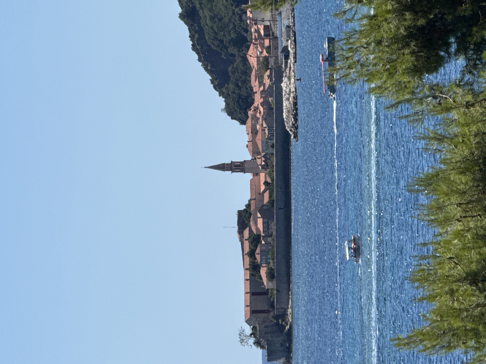 Budva's beach and waterfront buzzing on a July morning