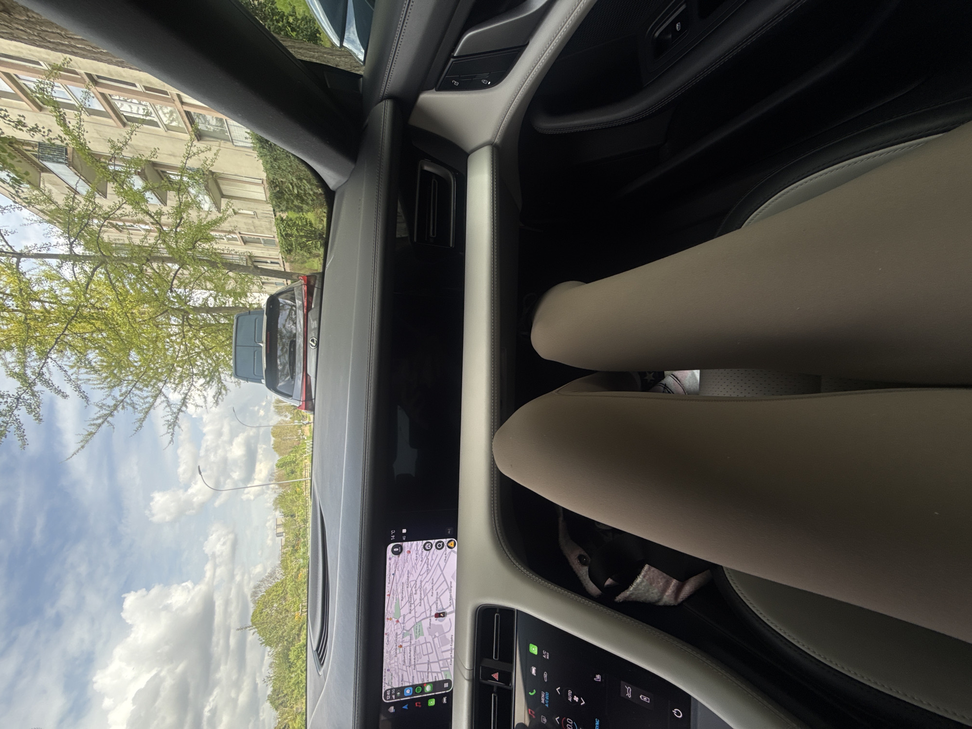 Passenger moment captured inside Porsche in L'Haÿ-les-Roses suburbs