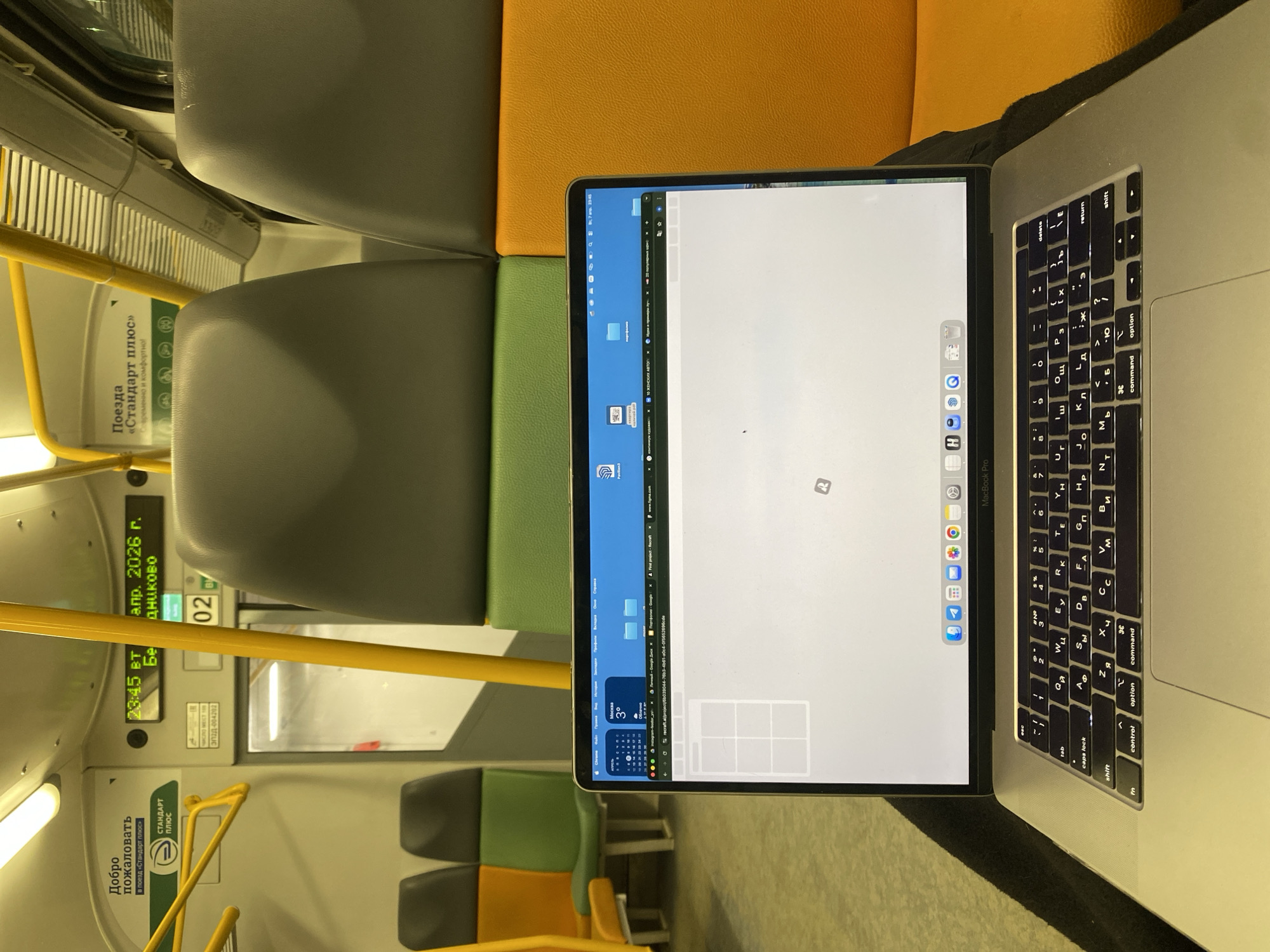 Laptop spotted on Moscow train seat during evening commute