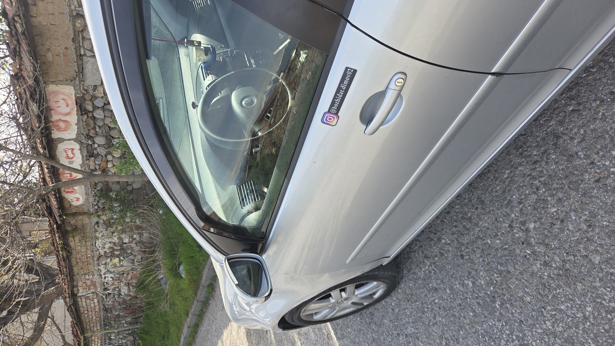 Silver VW Golf documented extensively in Bulgarian village morning