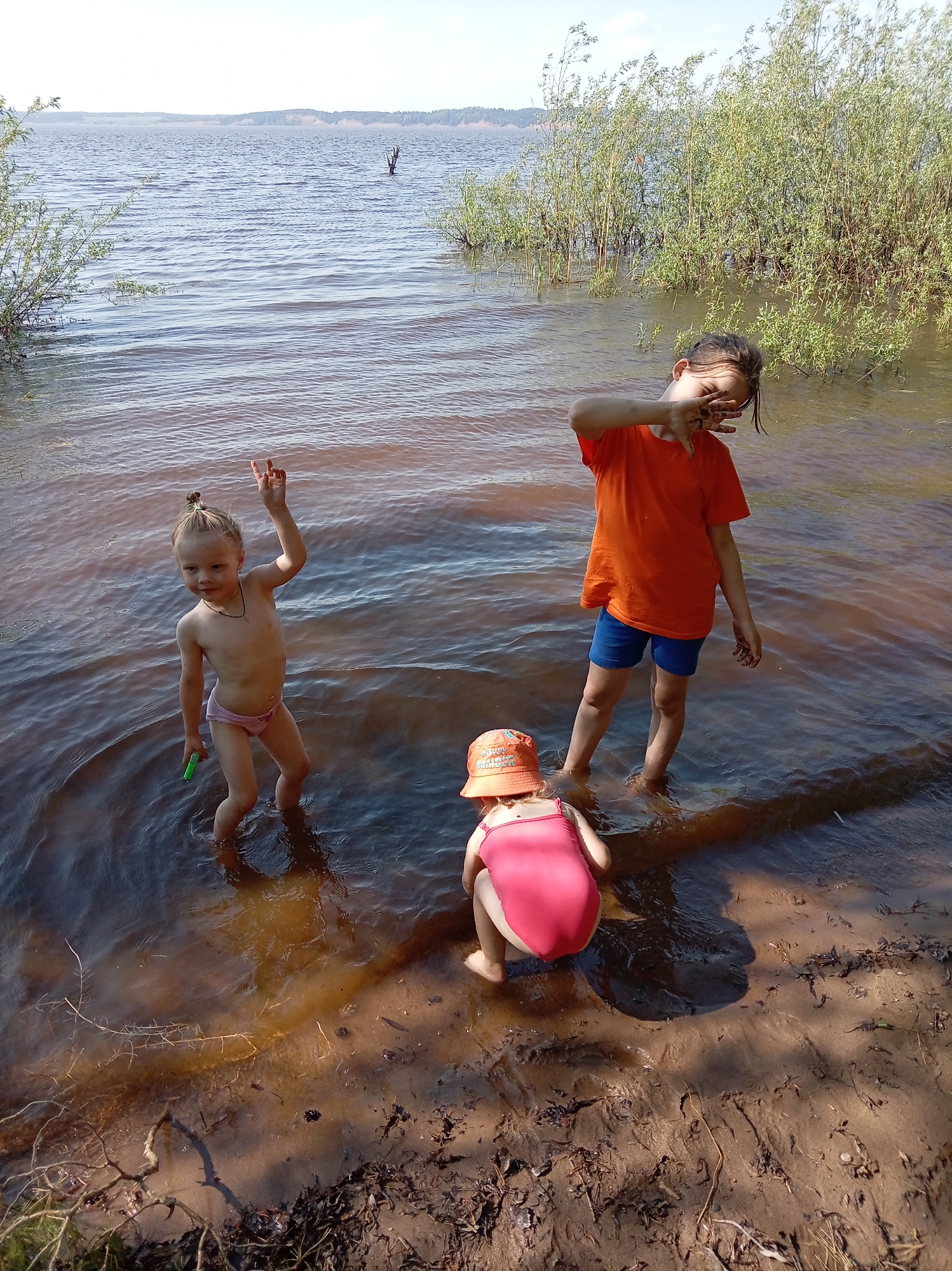 Children play in shallow water in Shul'dikha, Russia