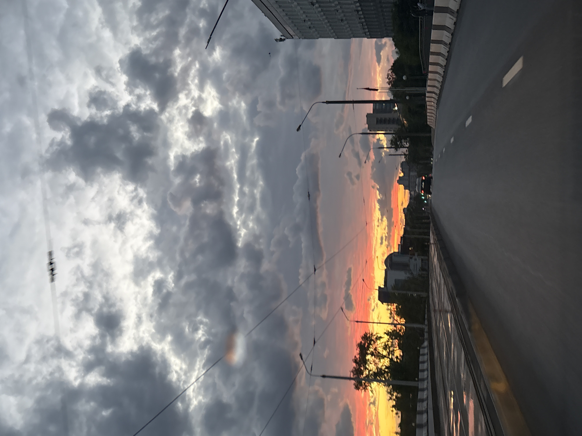 Taxi stops at traffic light during stormy sunset in Minsk