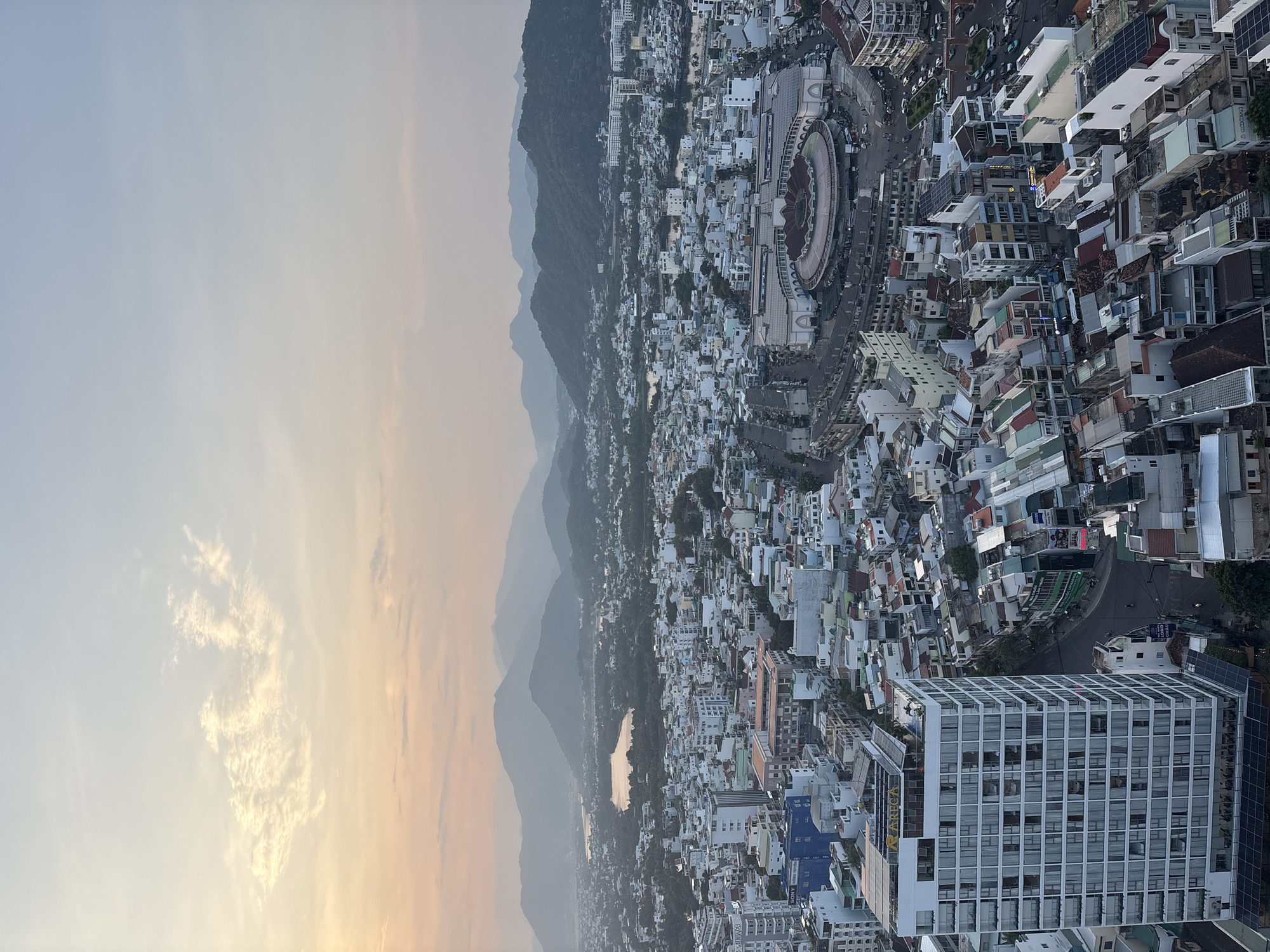 Tourist documents daily life scenes across Nha Trang Ward