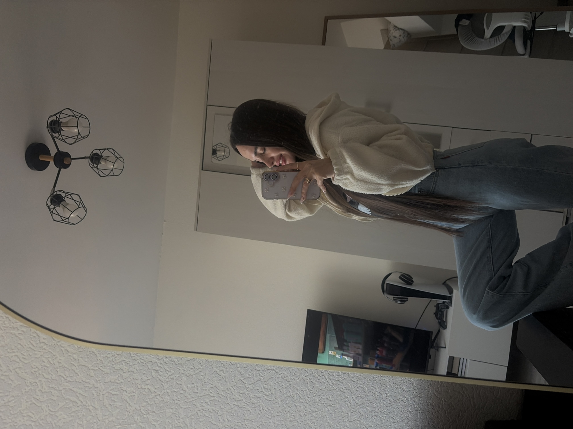 Woman takes mirror selfie in Saint Petersburg apartment