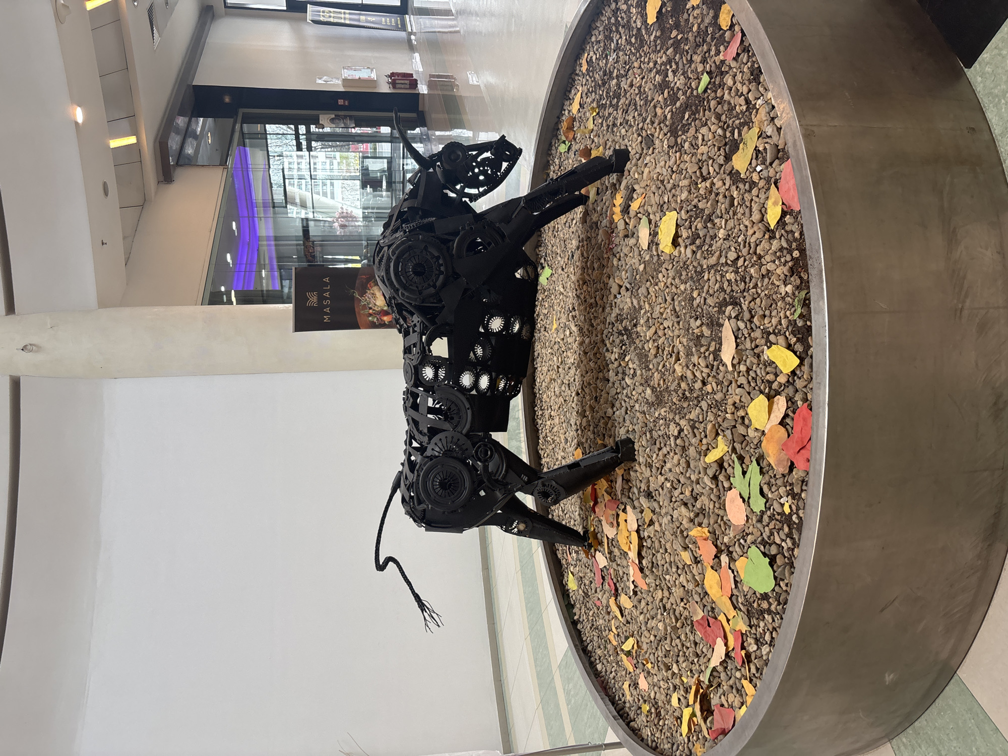 Recycled metal bull sculpture observed in Varna planter