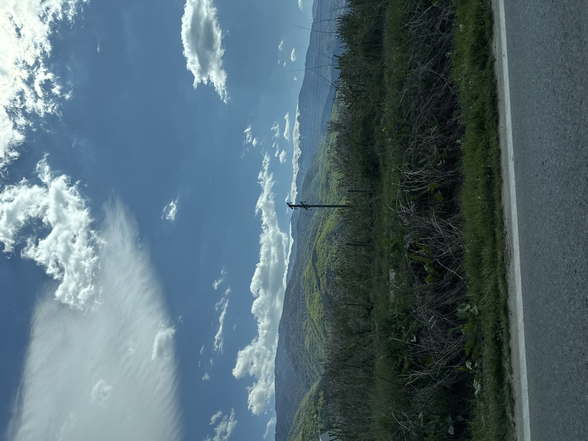Rural landscape with road and mountains documented near Parvomai