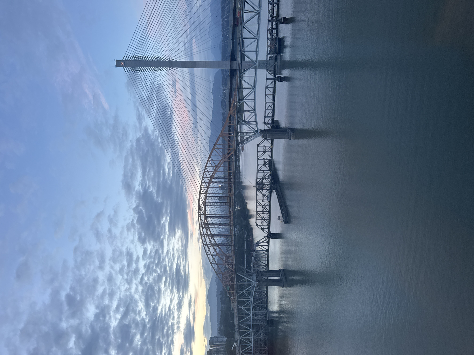 Fraser River at dawn, three bridges stretching across the water