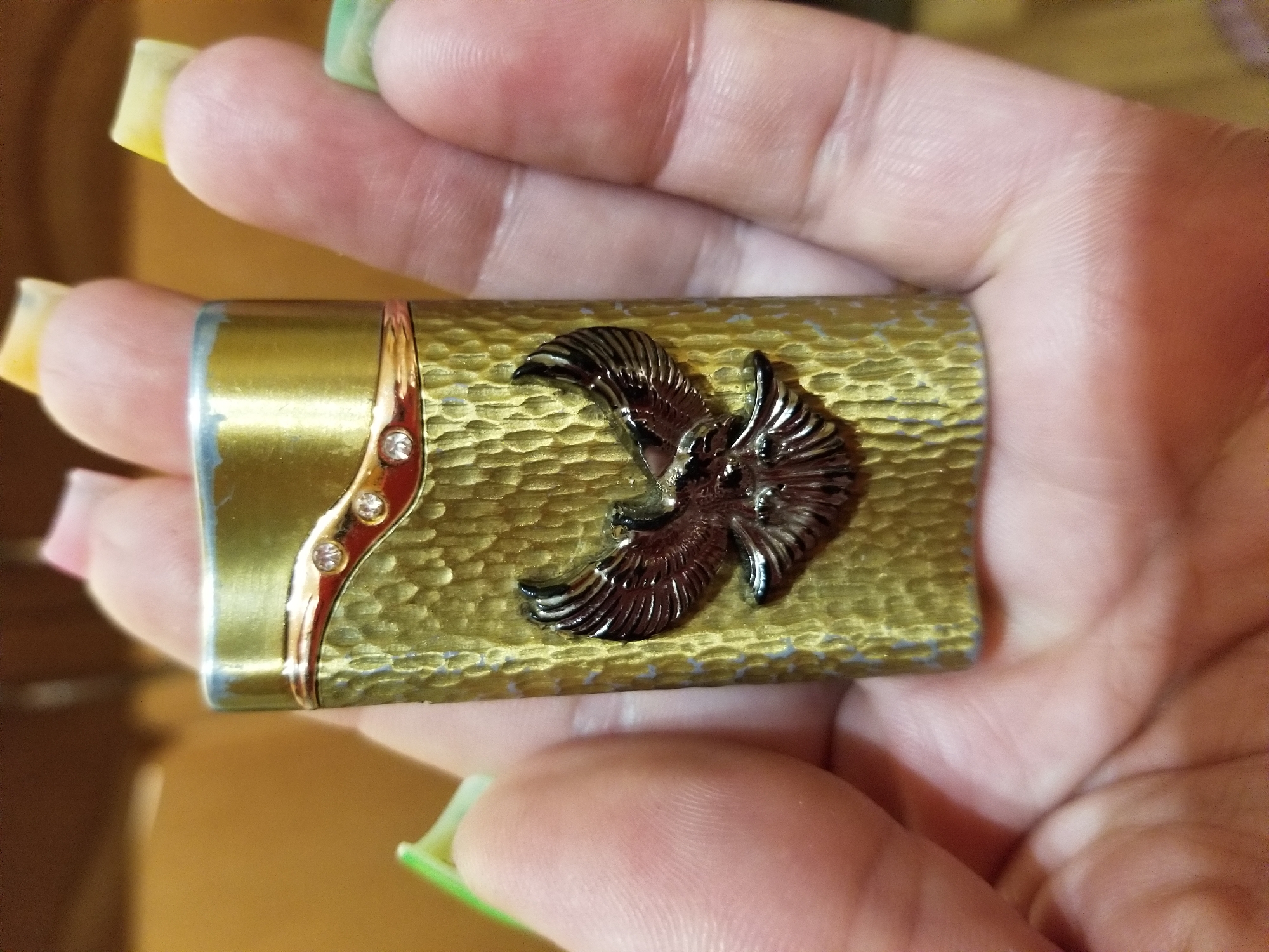 Ornate eagle lighter examined up close in Tiraspol