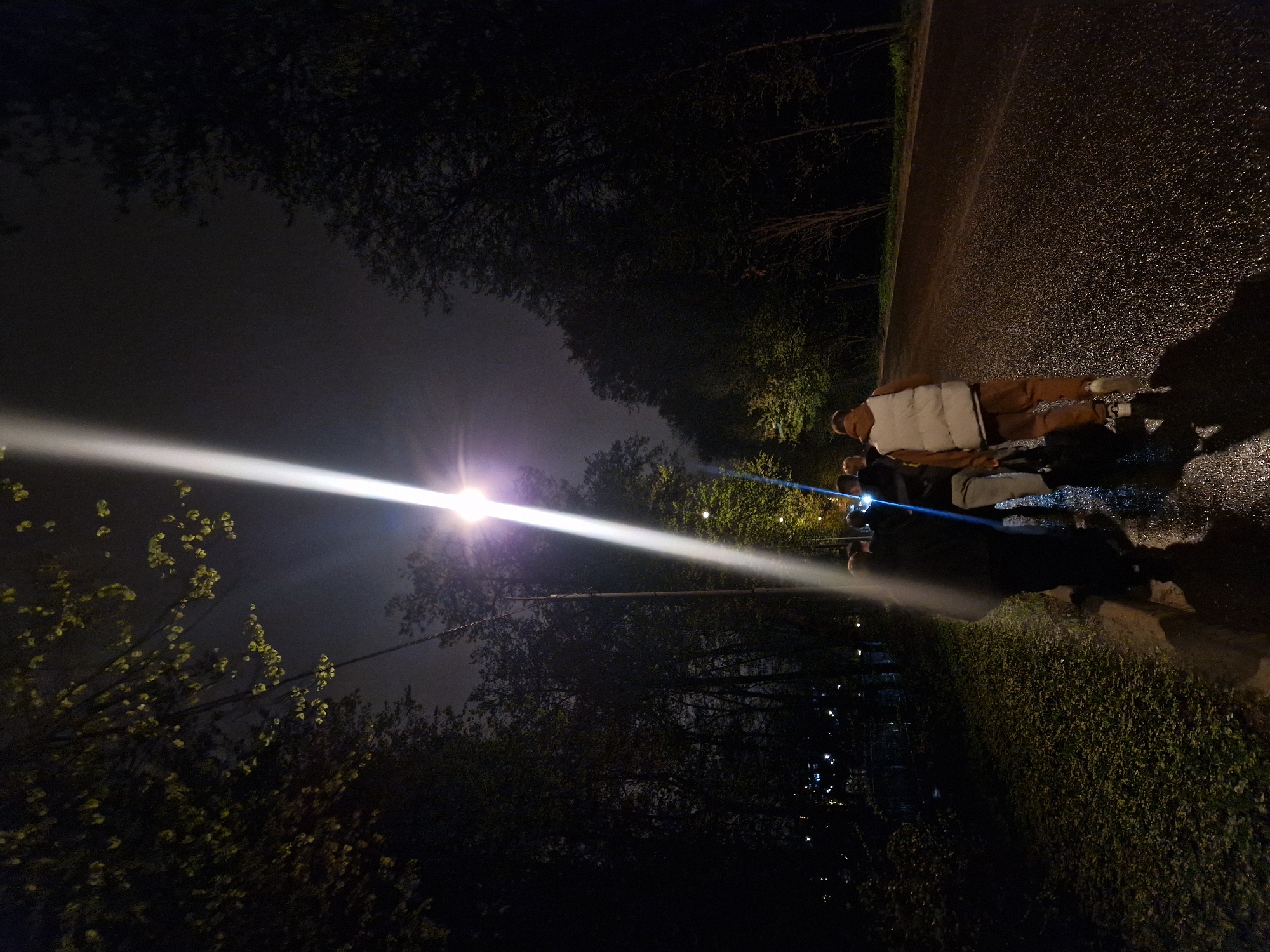 Group directs light beams on wet Moscow pathway
