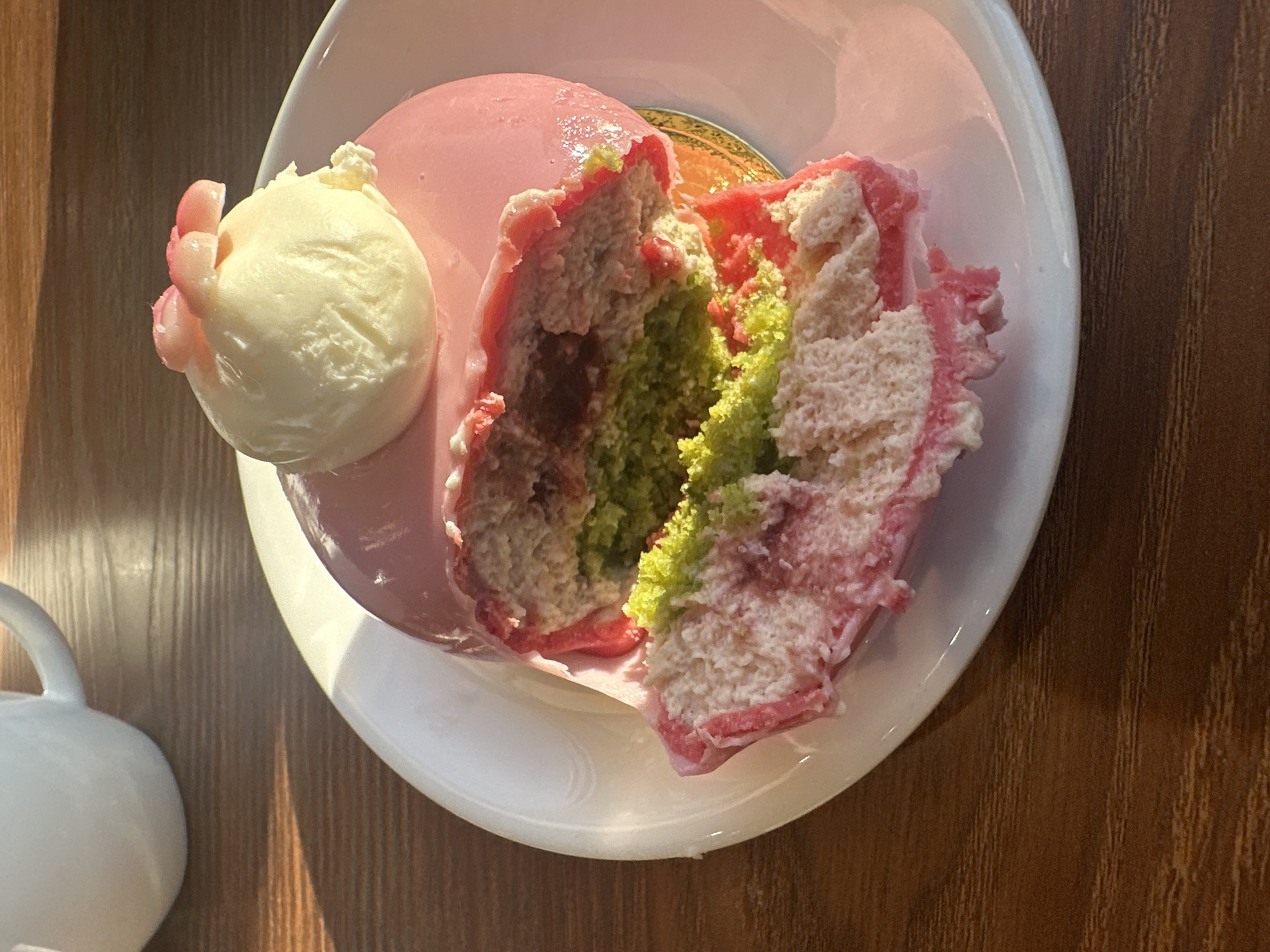 Pink dome dessert cut and served in Moscow